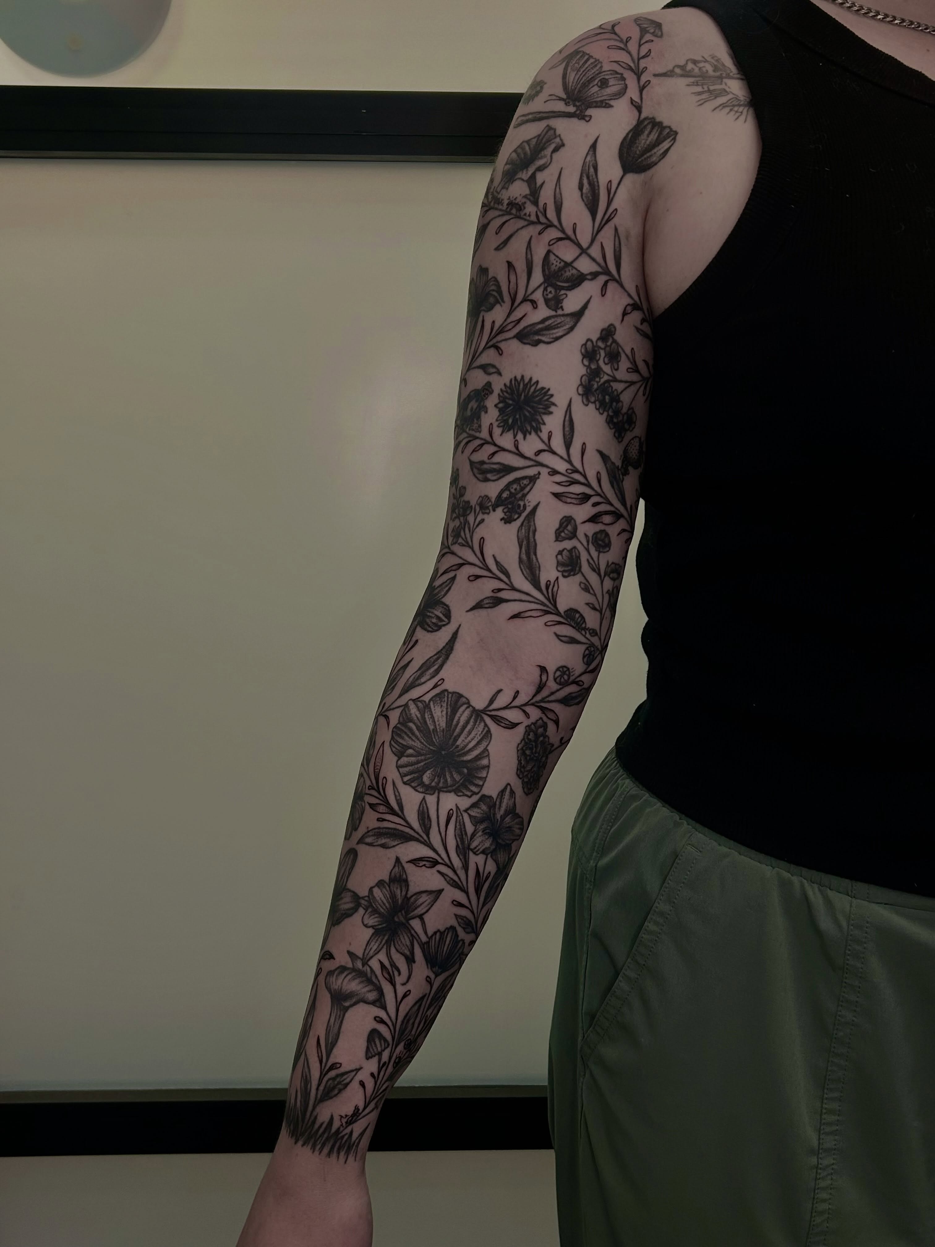 Floral pattern black and grey tattoo on the forearm by Kenadee