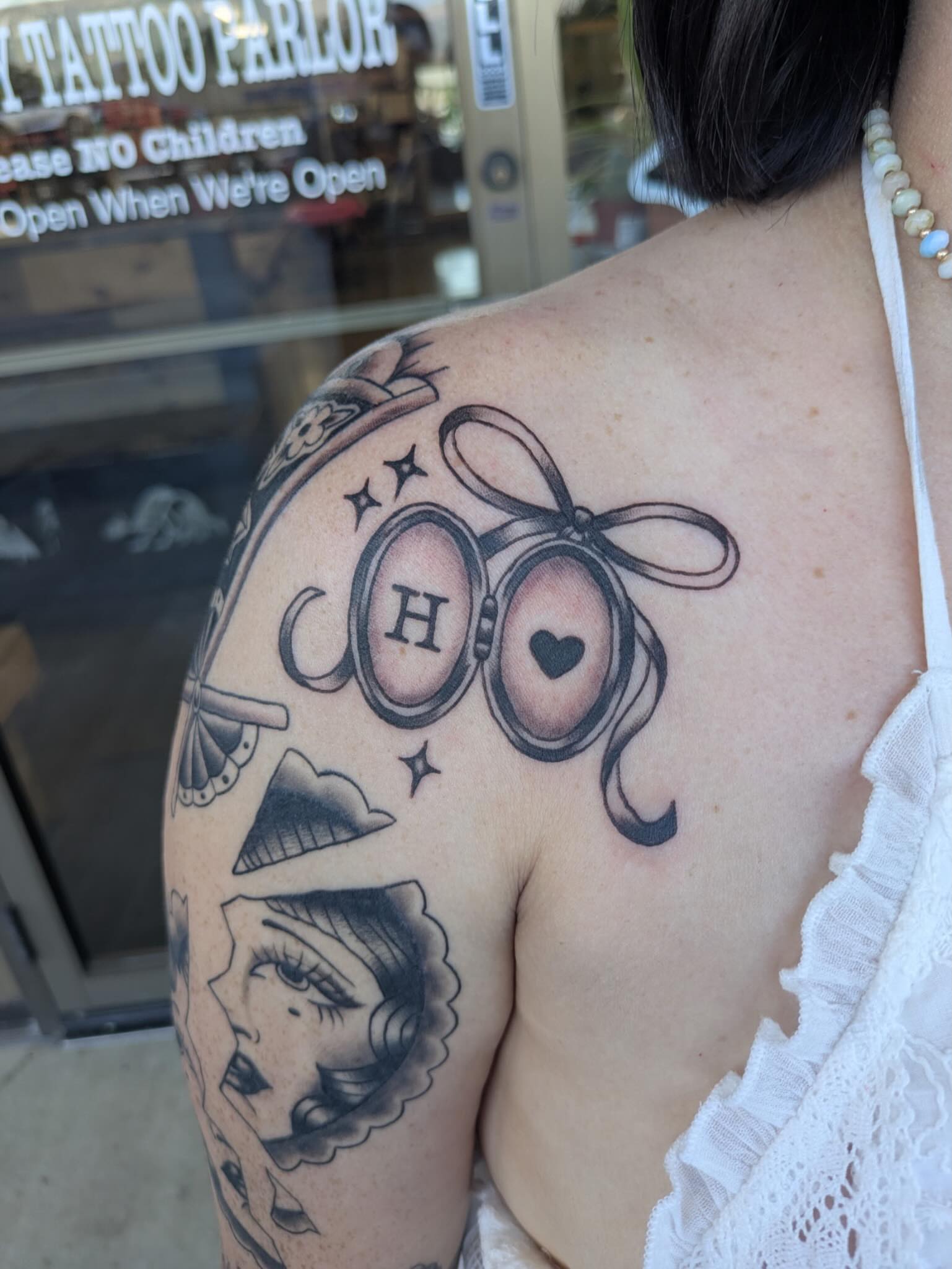 Goggles and bow American traditional tattoo on the shoulder by ♡ Cora ♡