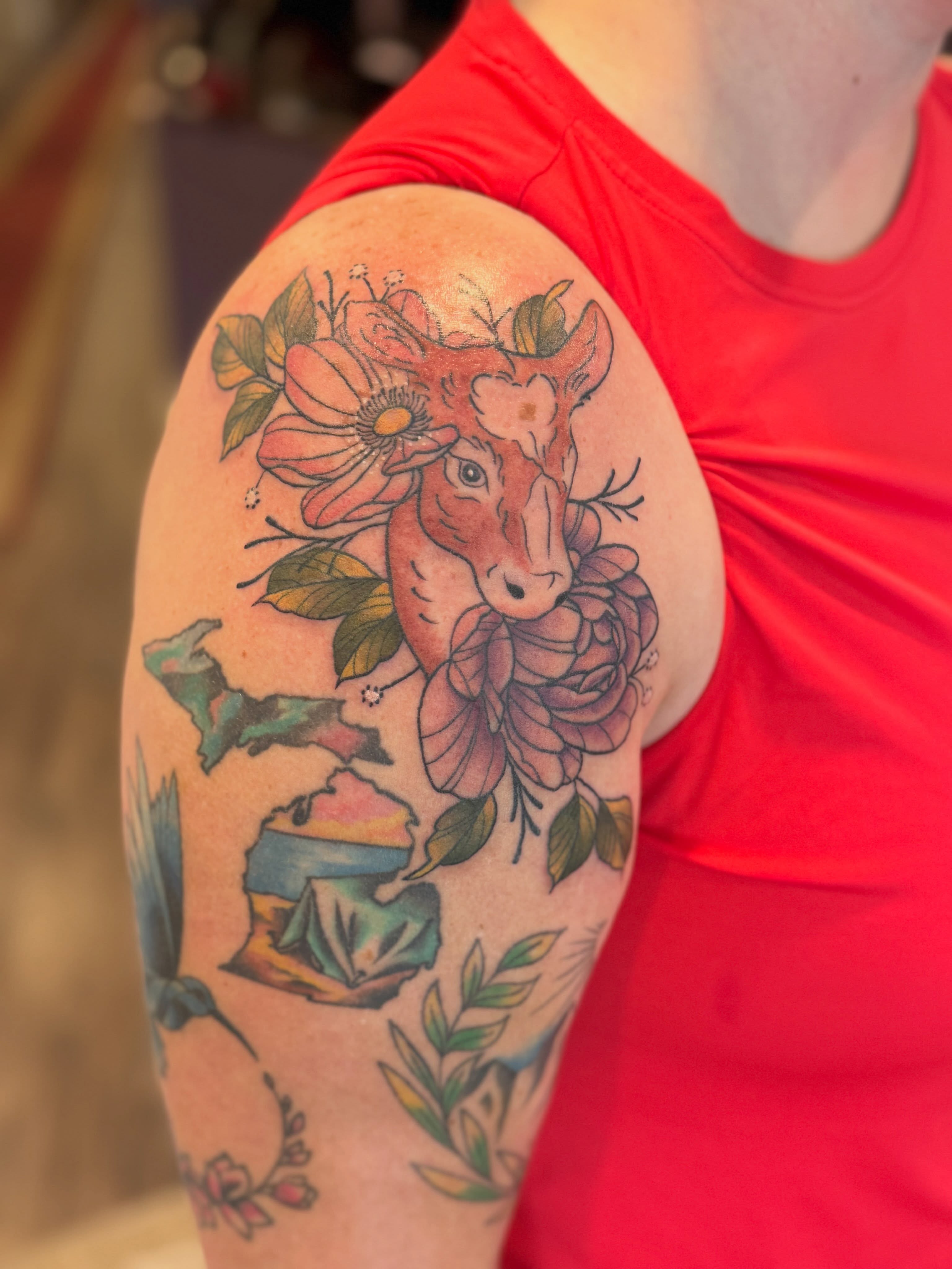 Deer and flowers new school tattoo on the upper arm by Aly Rucker, Murfreesboro, Tennessee