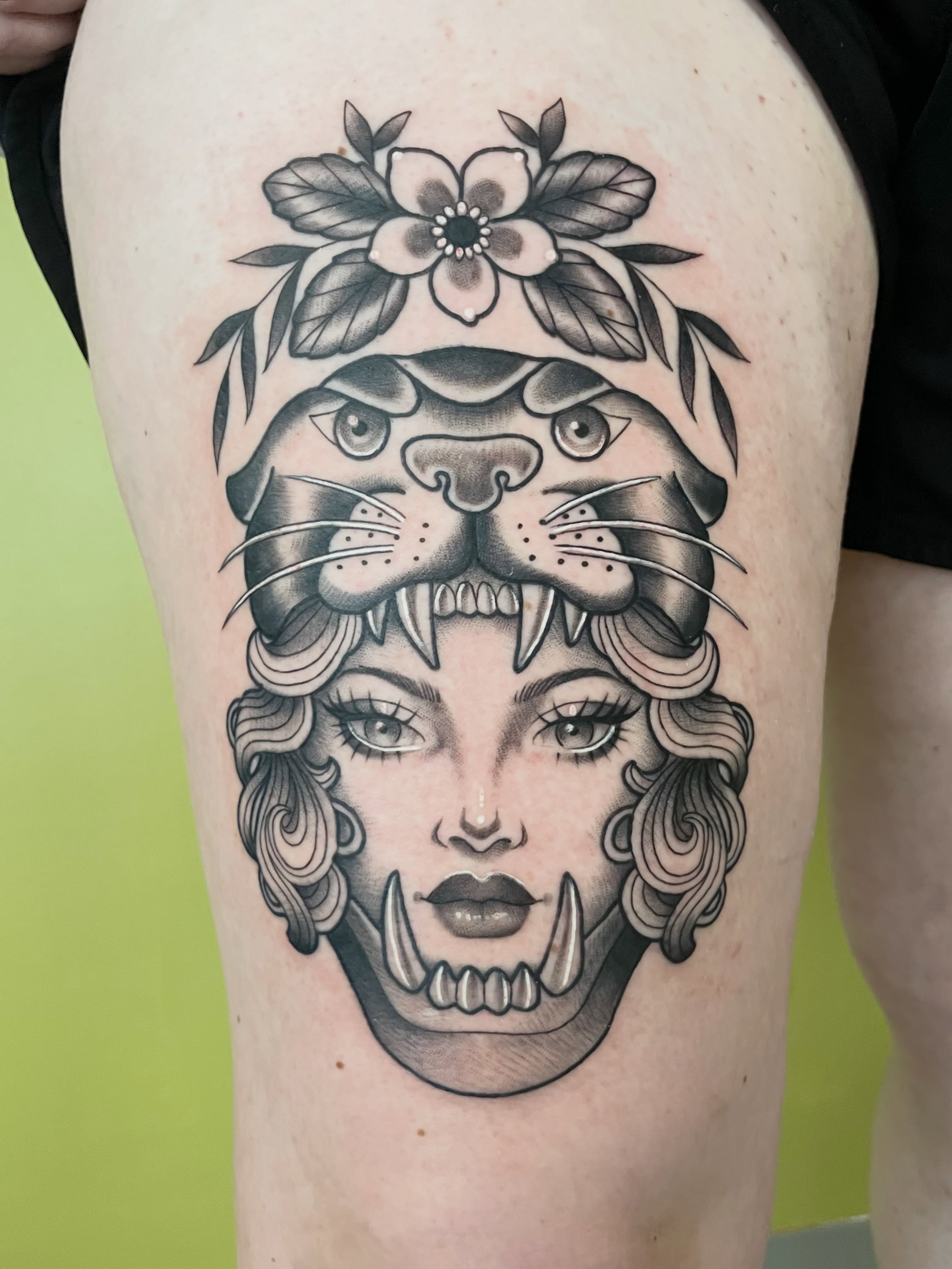Woman with tiger head American traditional tattoo on the thigh by ✨Erin Haines✨