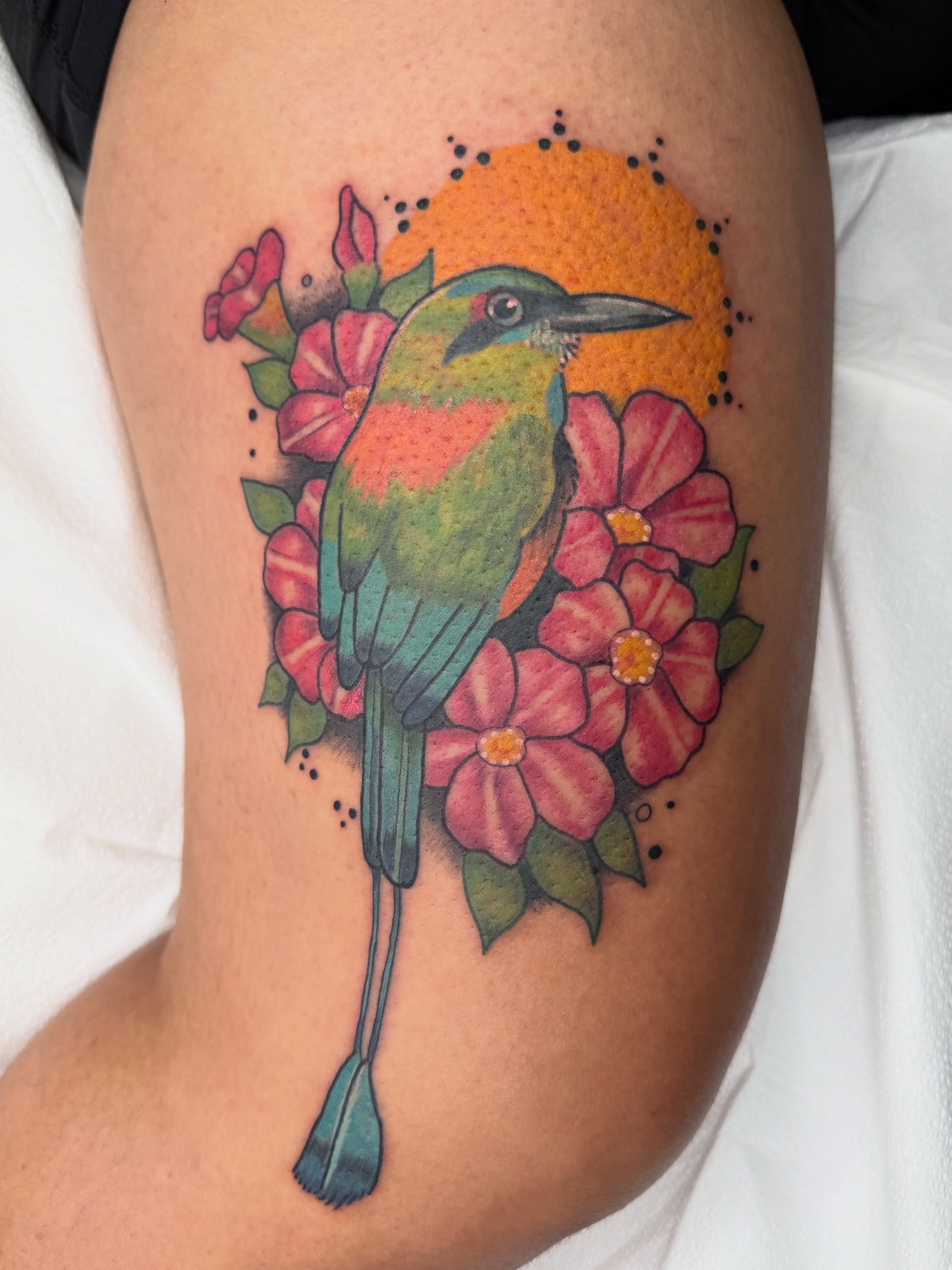 Bird and flowers dotwork tattoo on the thigh by AJ Jensen
