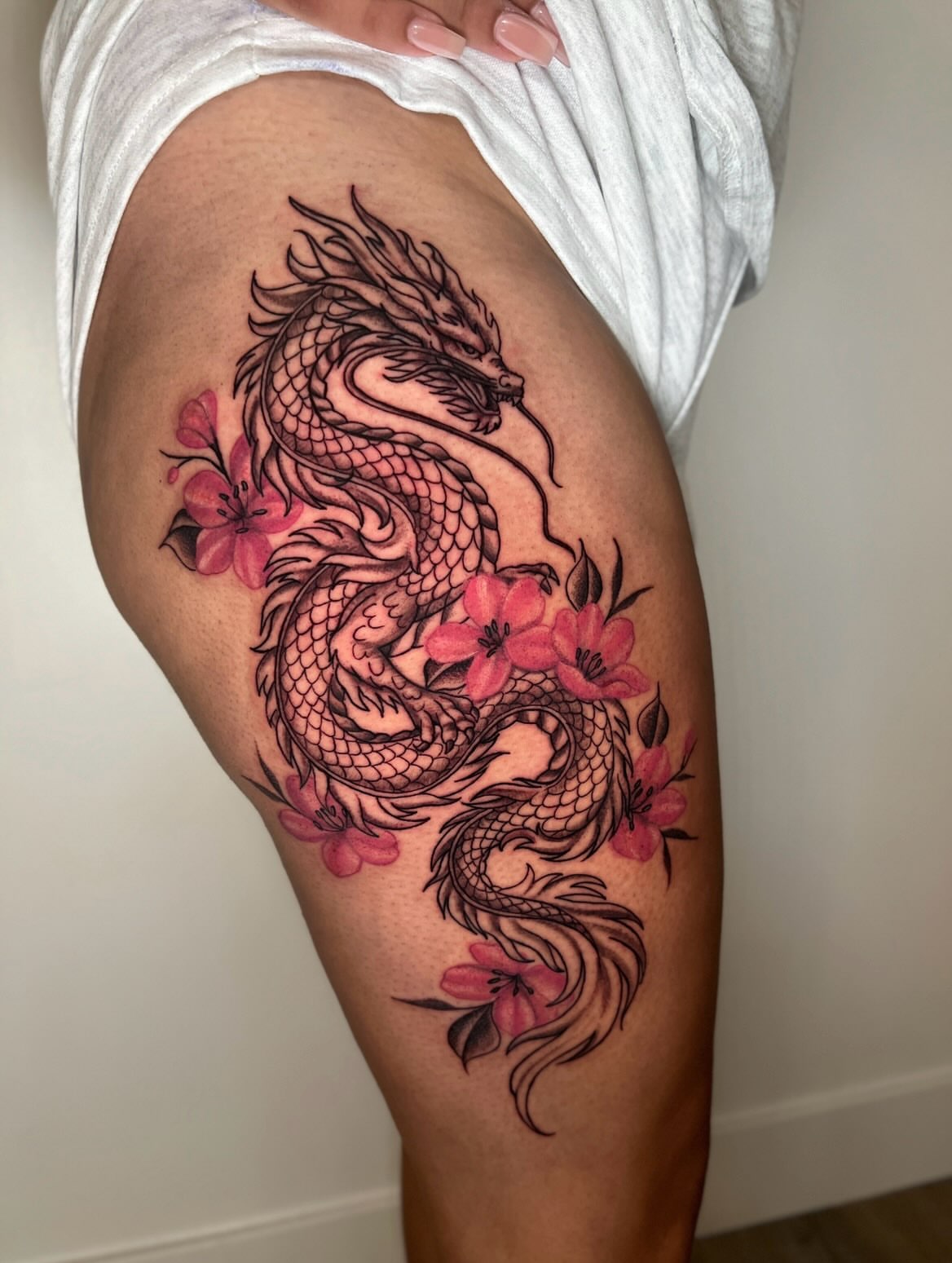 Dragon and cherry blossoms japanese irezumi tattoo on the thigh by ππππππ ππππππ - ππππ‘ππ₯ ππ¨π₯π’πππ«π’π¨π¬ π΅π