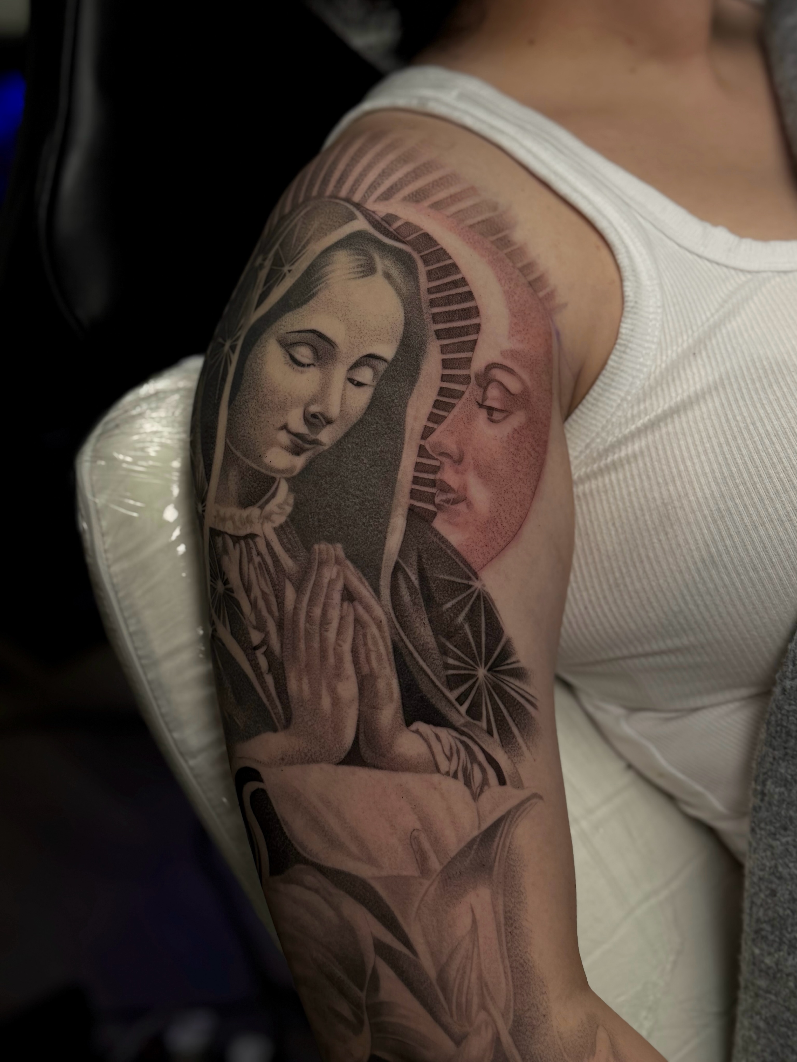 Religious figure praying realism tattoo on the forearm by Vanessa Valdivia