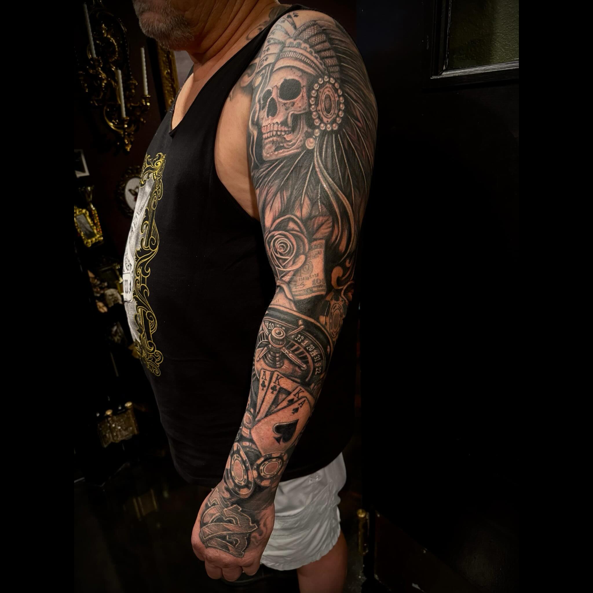 Indian chief skull American traditional tattoo on the upper arm by Shae Sullivan