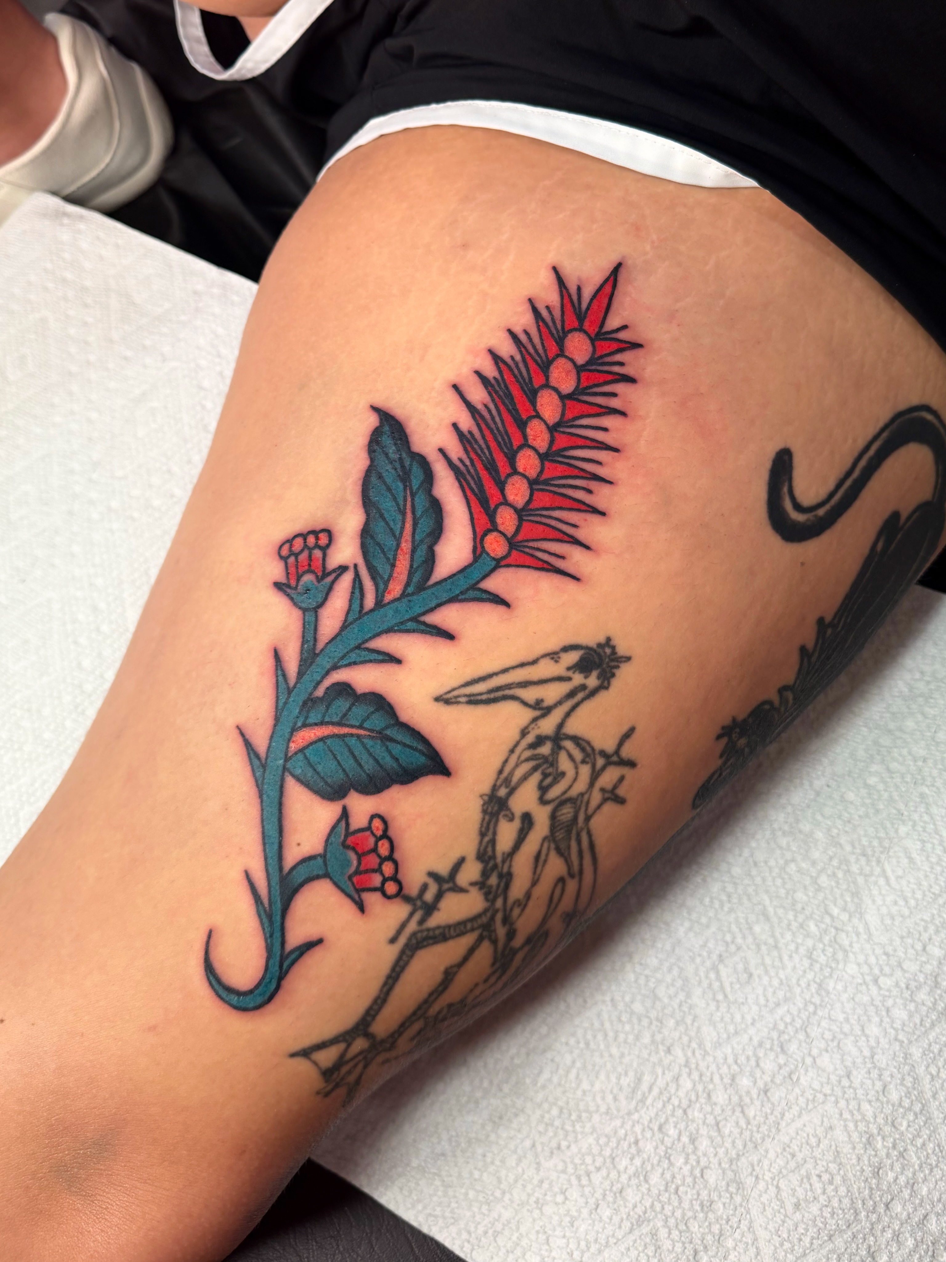 Flower and bird neo-traditional tattoo on the thigh by Myka King