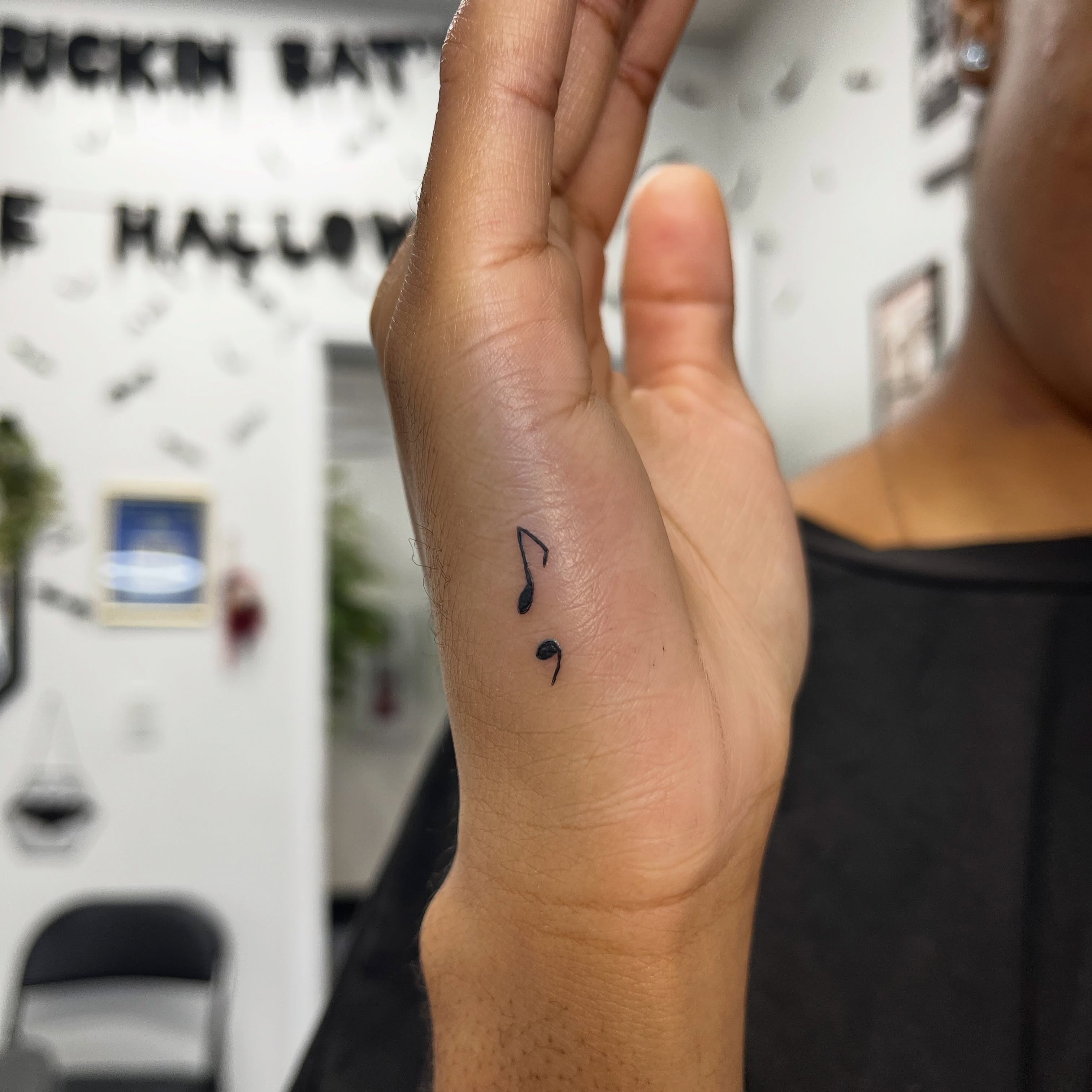 Music notes minimalist tattoo on the hand by Sid