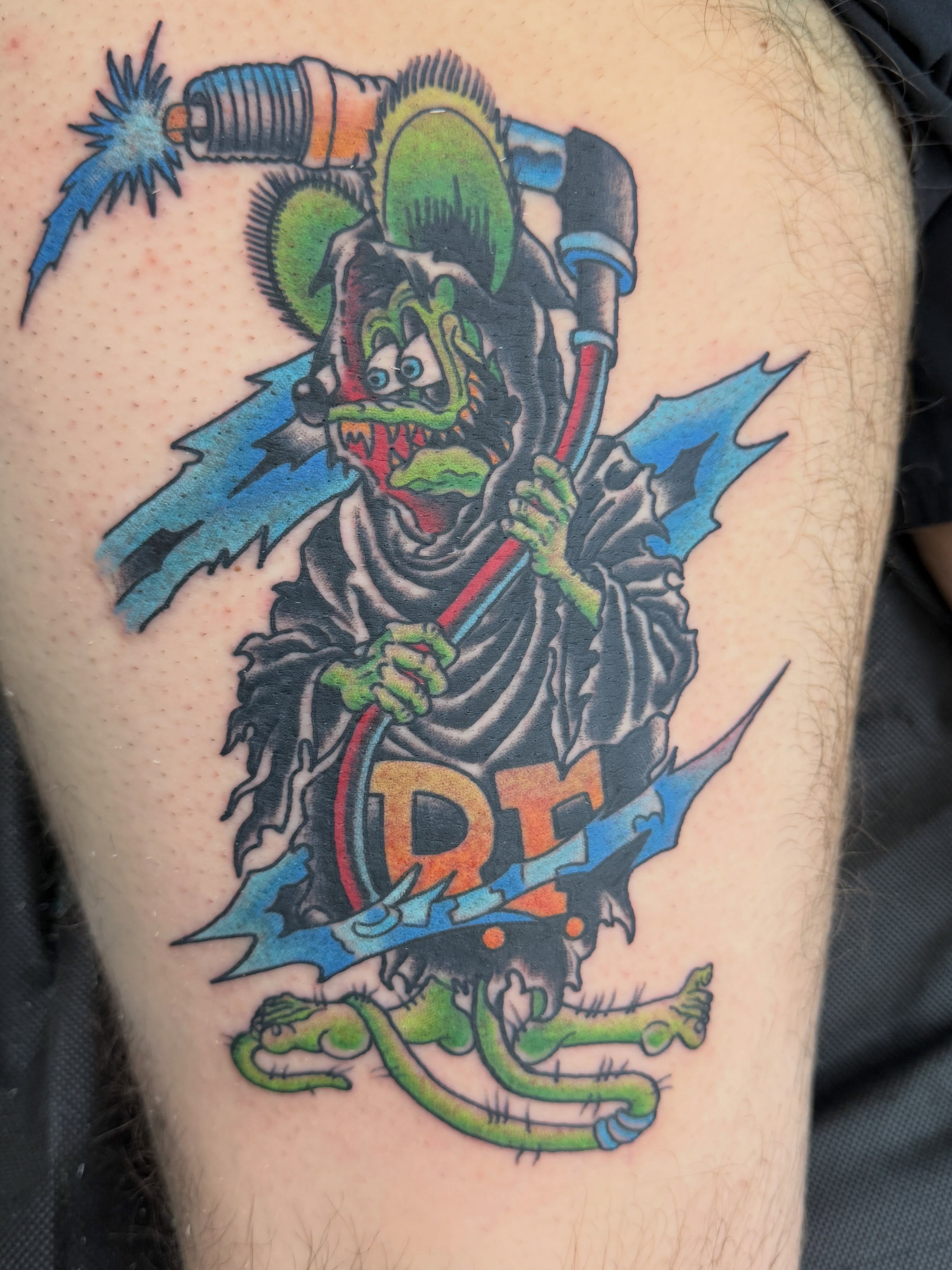 Clown with weapon American traditional tattoo on the thigh by Trent Parsley