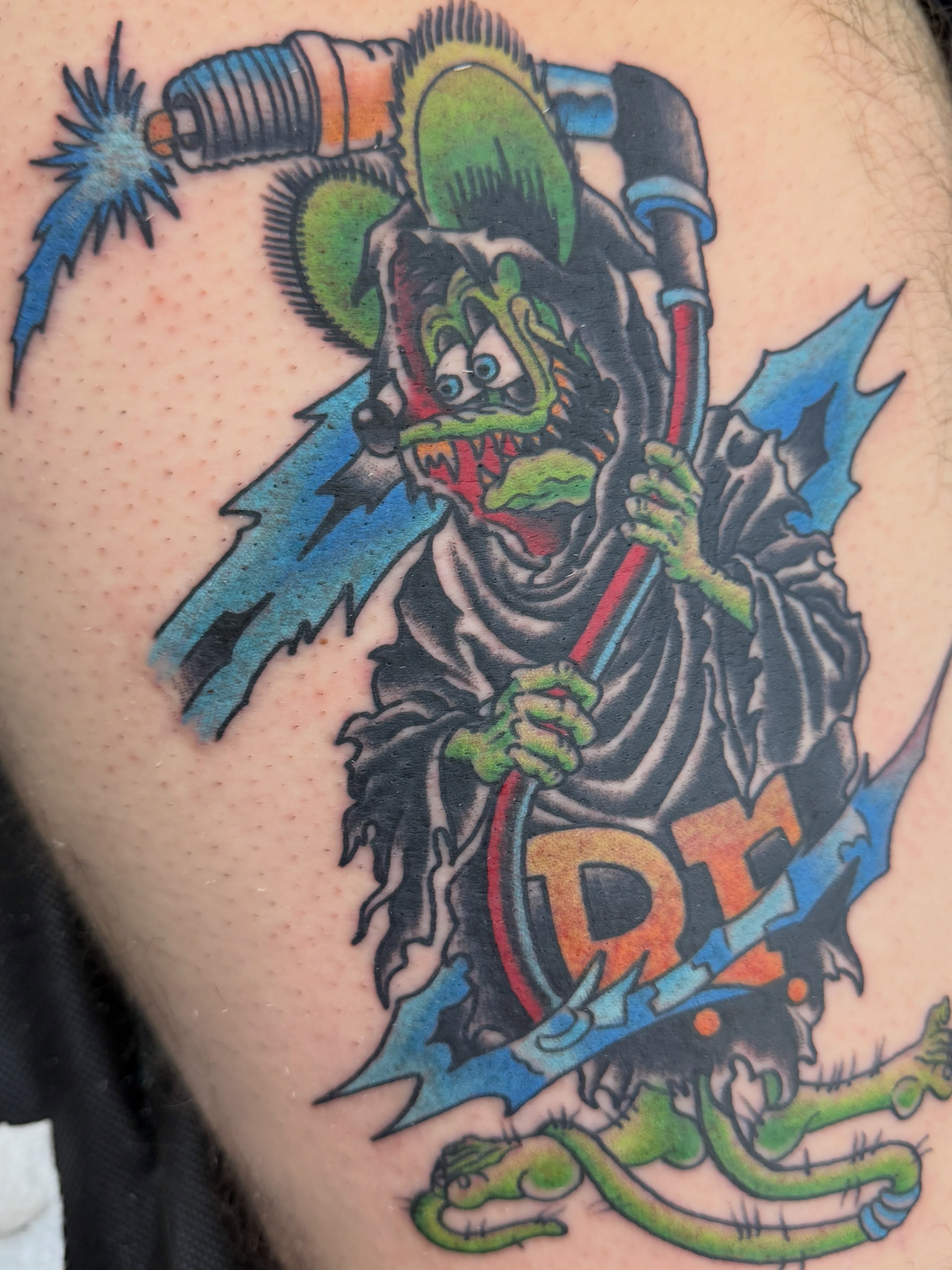 Jester with electric gun American traditional tattoo on the thigh by Trent Parsley