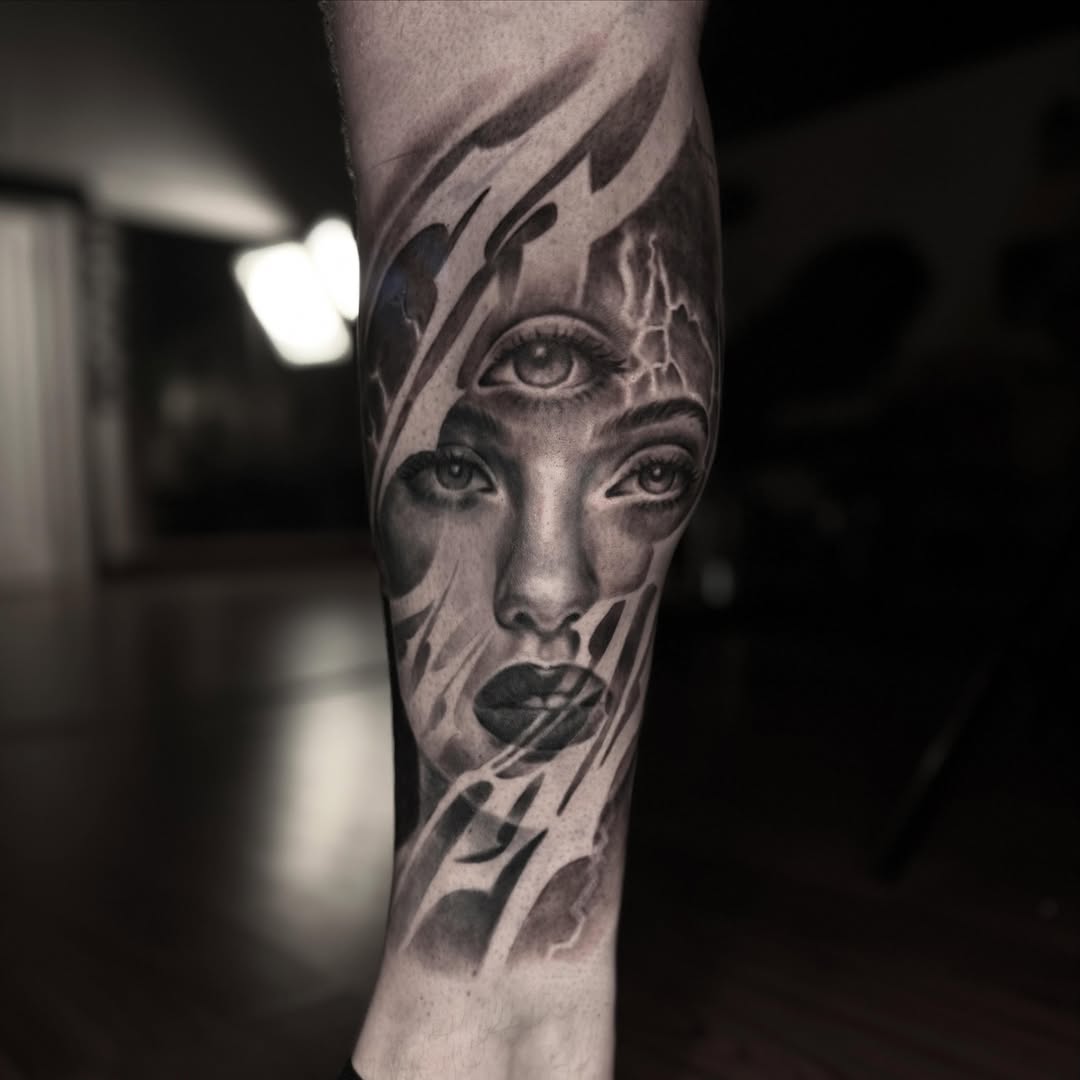 Woman's face realism tattoo on the forearm by Jeremiah Warner