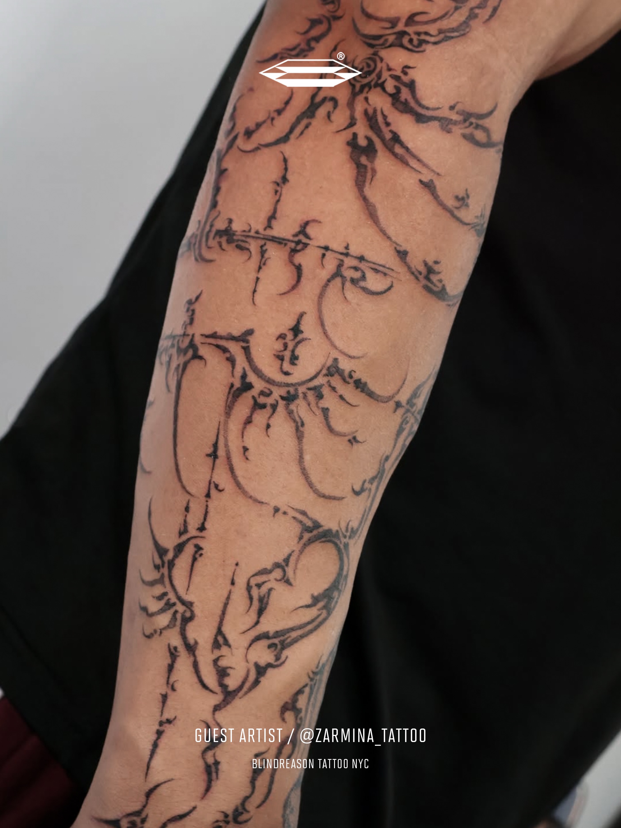Abstract design black and grey tattoo on the forearm by Grace Zarmina Hessam
