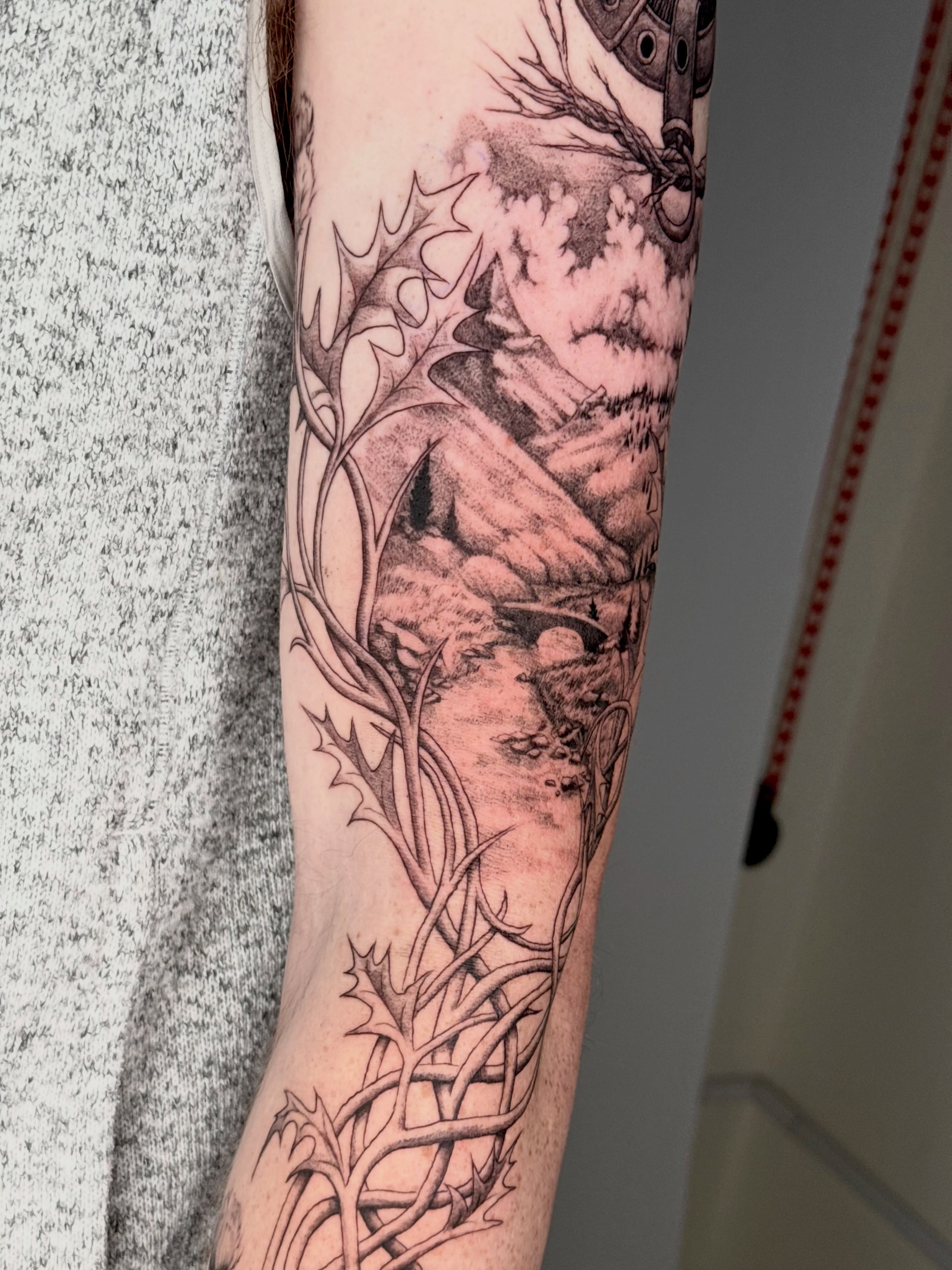 Landscape with thorns realism tattoo on the forearm by Andrew Flatts