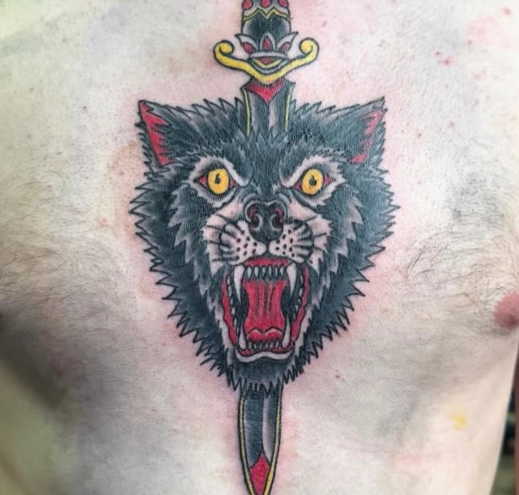 Wolf head American traditional tattoo on the chest by Brazun Locker Poloschan