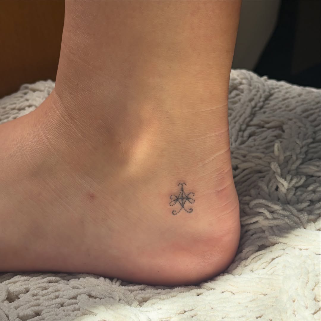 Geometric symbol geometric tattoo on the foot by kari