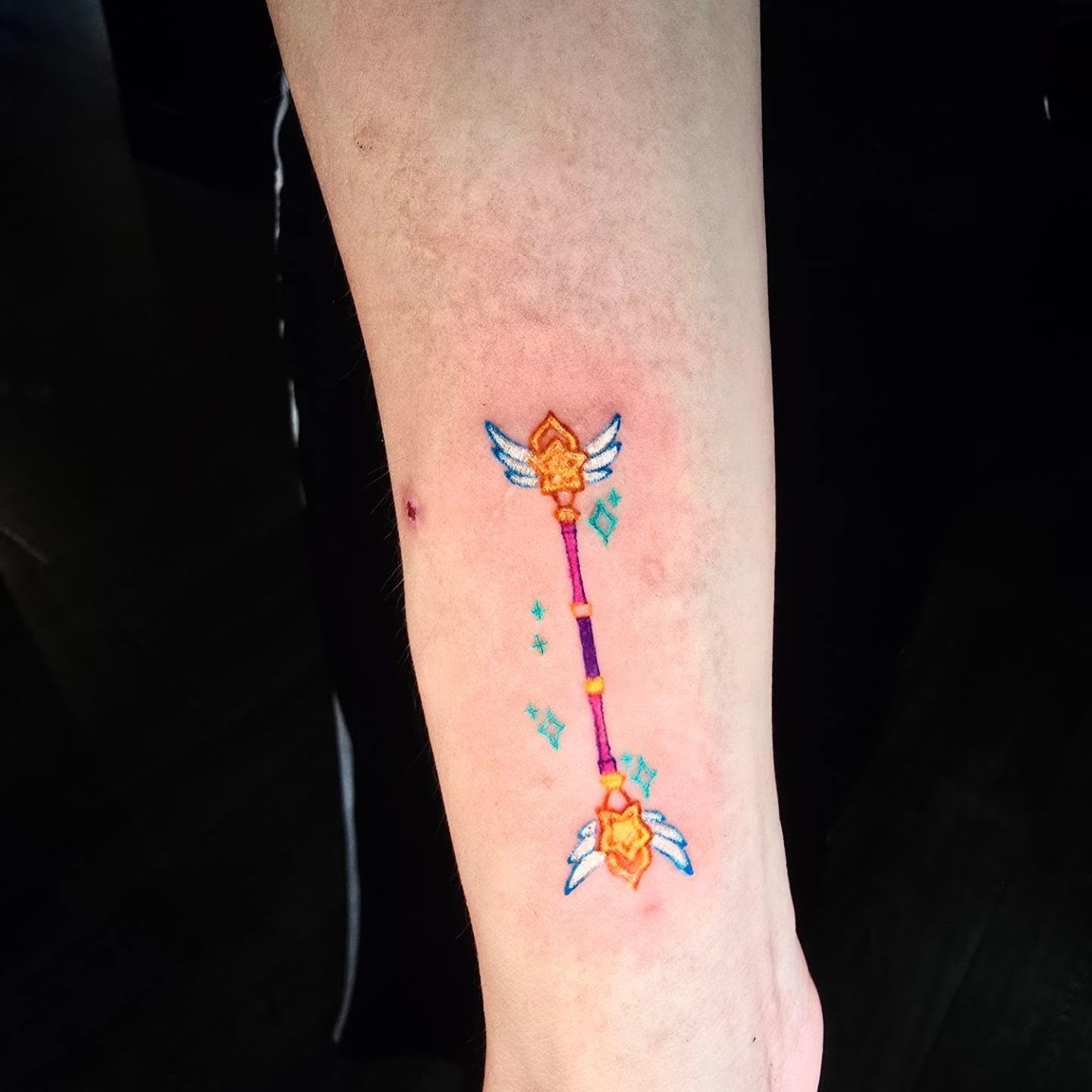 Magic staff new school tattoo on the forearm by Tucker