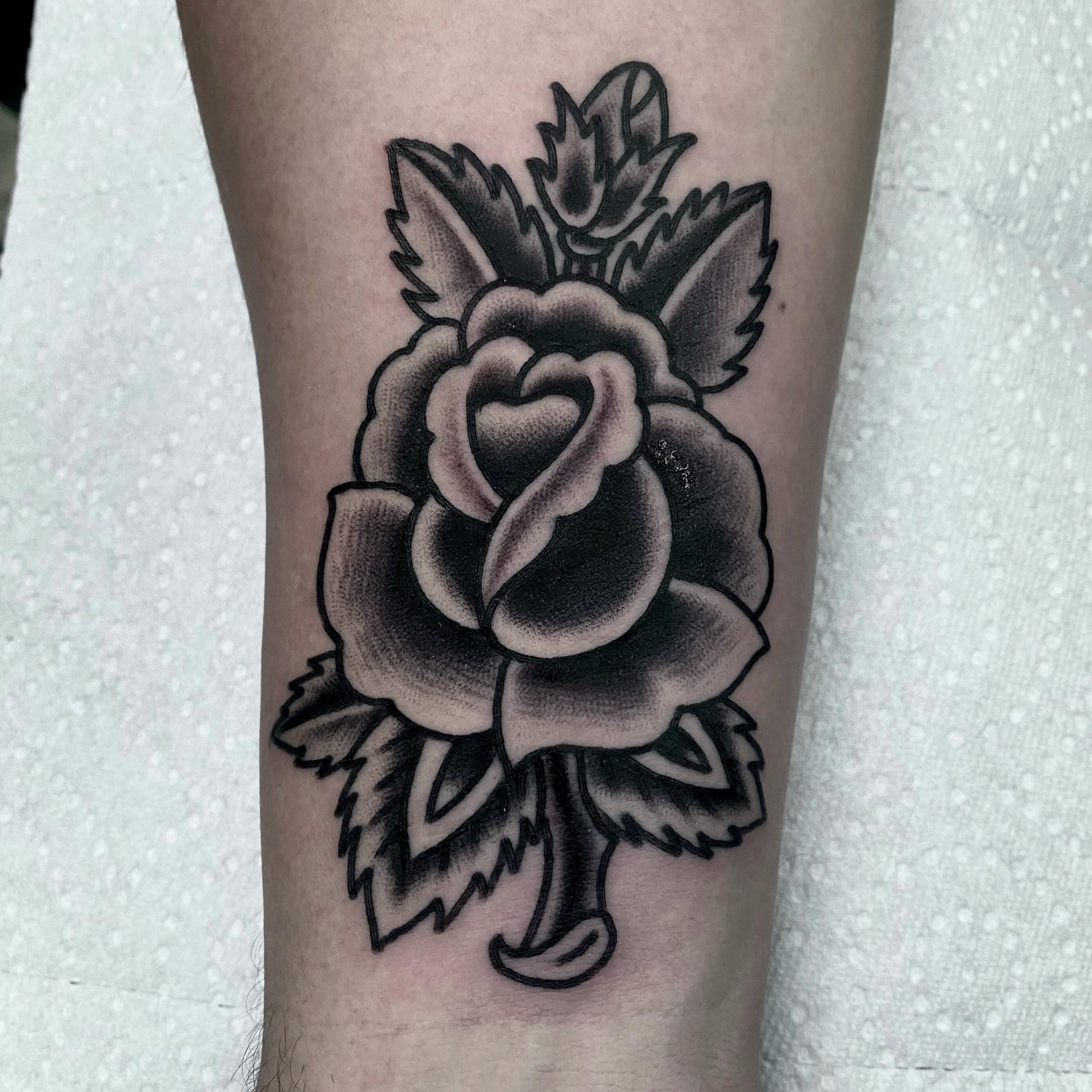 Rose black and grey tattoo on the forearm by Brandon Heredia, Vacaville, California