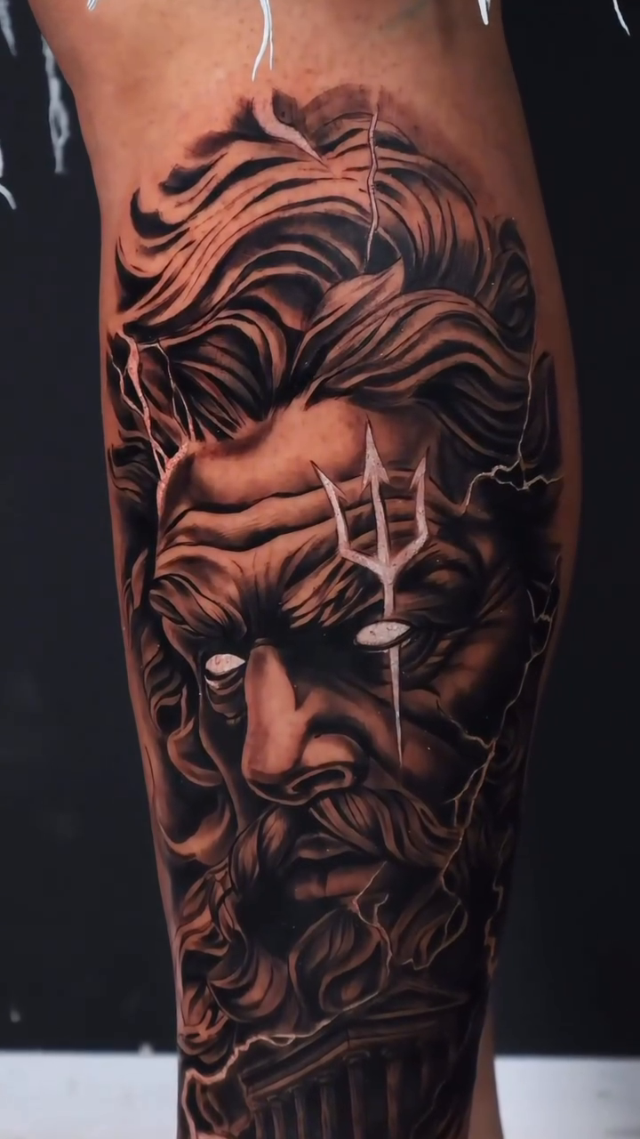 Portrait of a mythological figure surrealism tattoo on the calf by German Patiño.