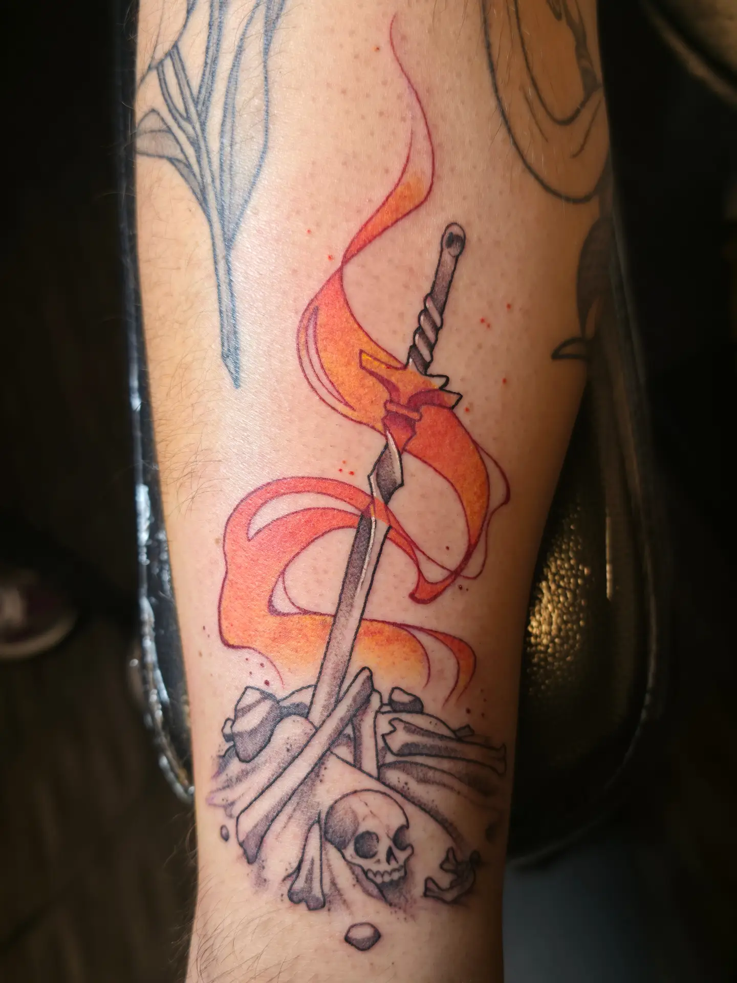 Sword and flame neo-traditional tattoo on the forearm by Kennedy Jones, Lee's Summit, Missouri