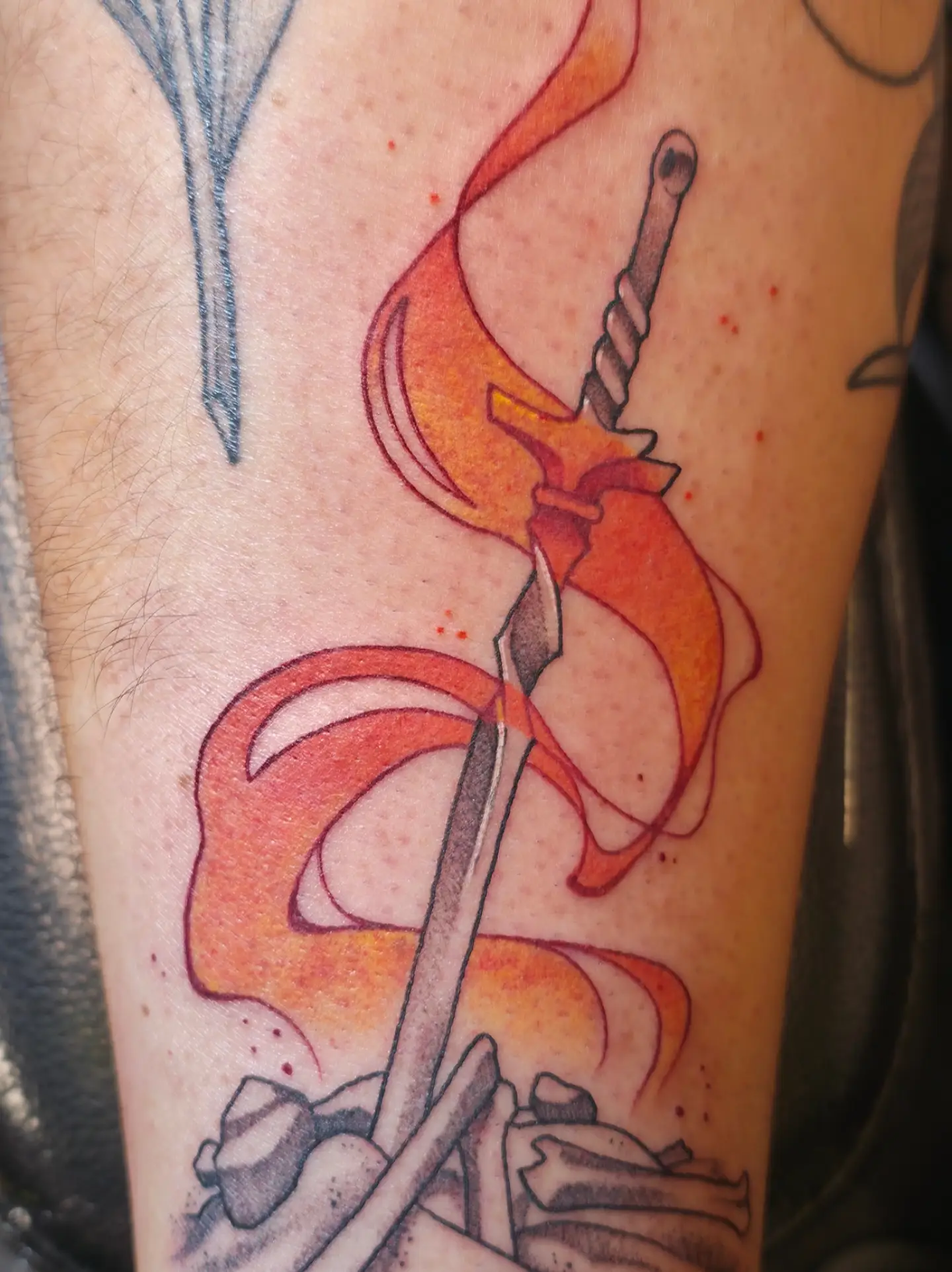 Sword and flame neo-traditional tattoo on the forearm by Kennedy Jones, Lee's Summit, Missouri