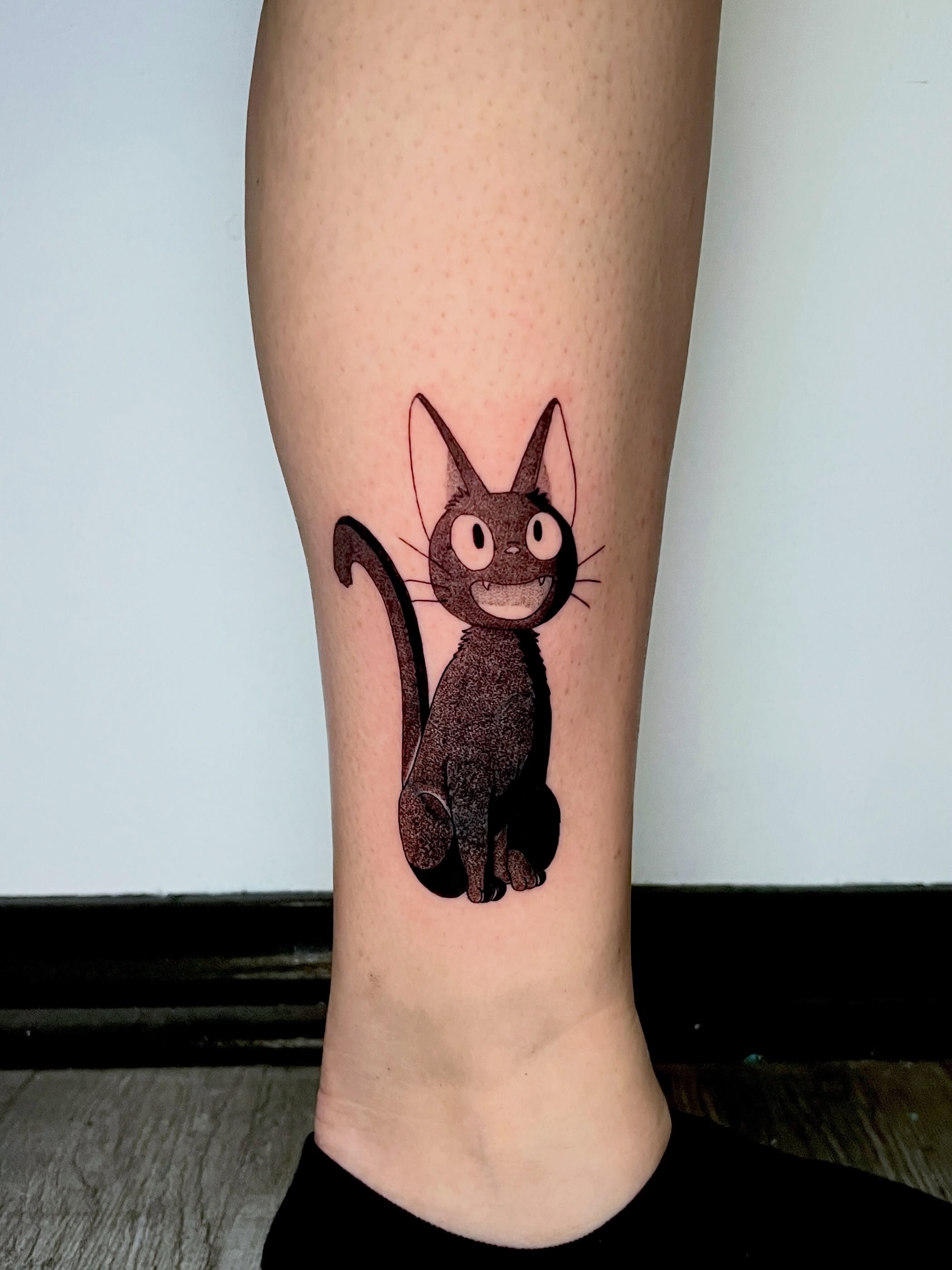 Jiji cat dotwork tattoo on the calf by AJ π°π· LA tattoo
