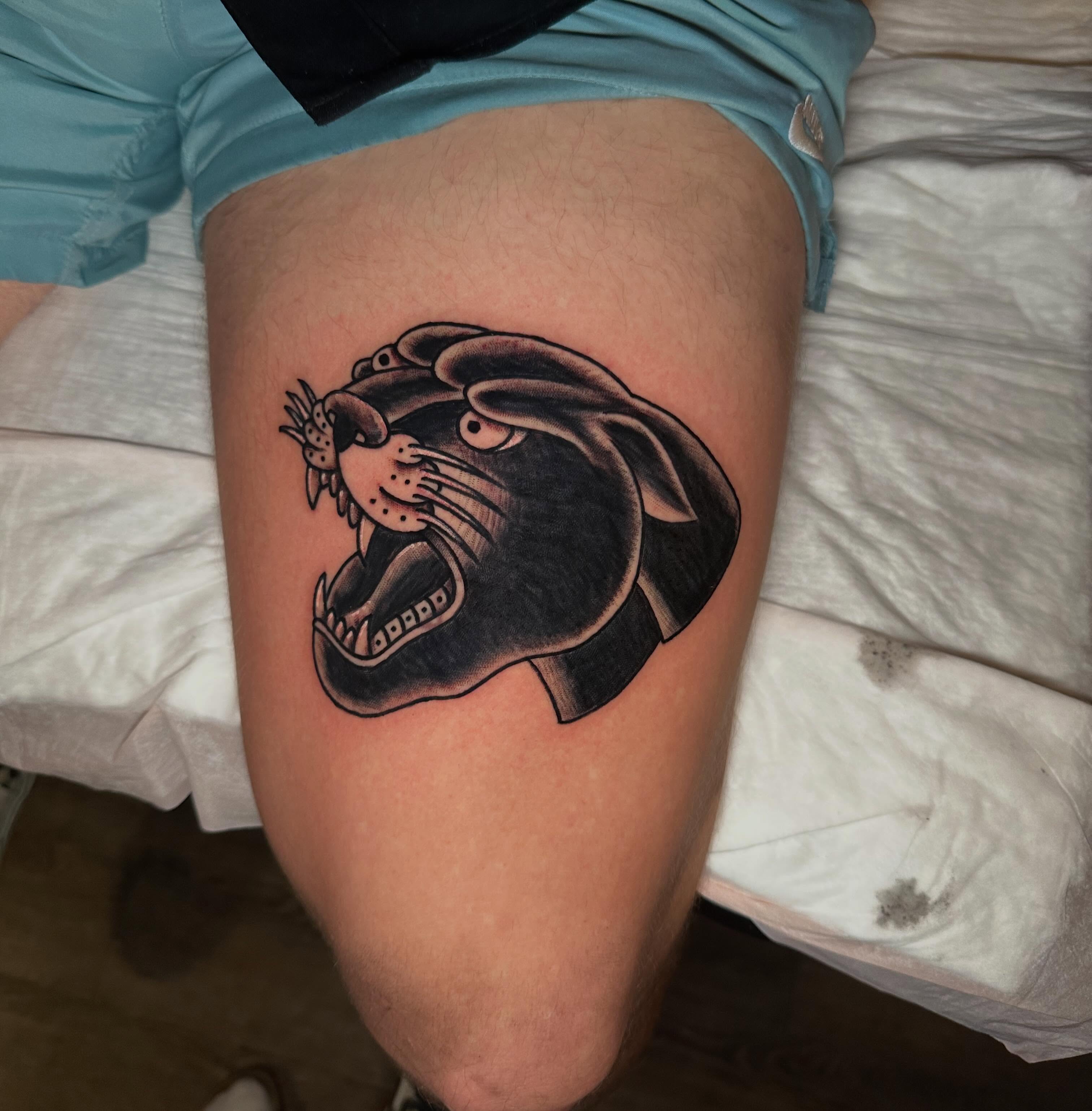 Panther head black and grey tattoo on the thigh by Jenni Hand - Tattoo, Maryville, Tennessee