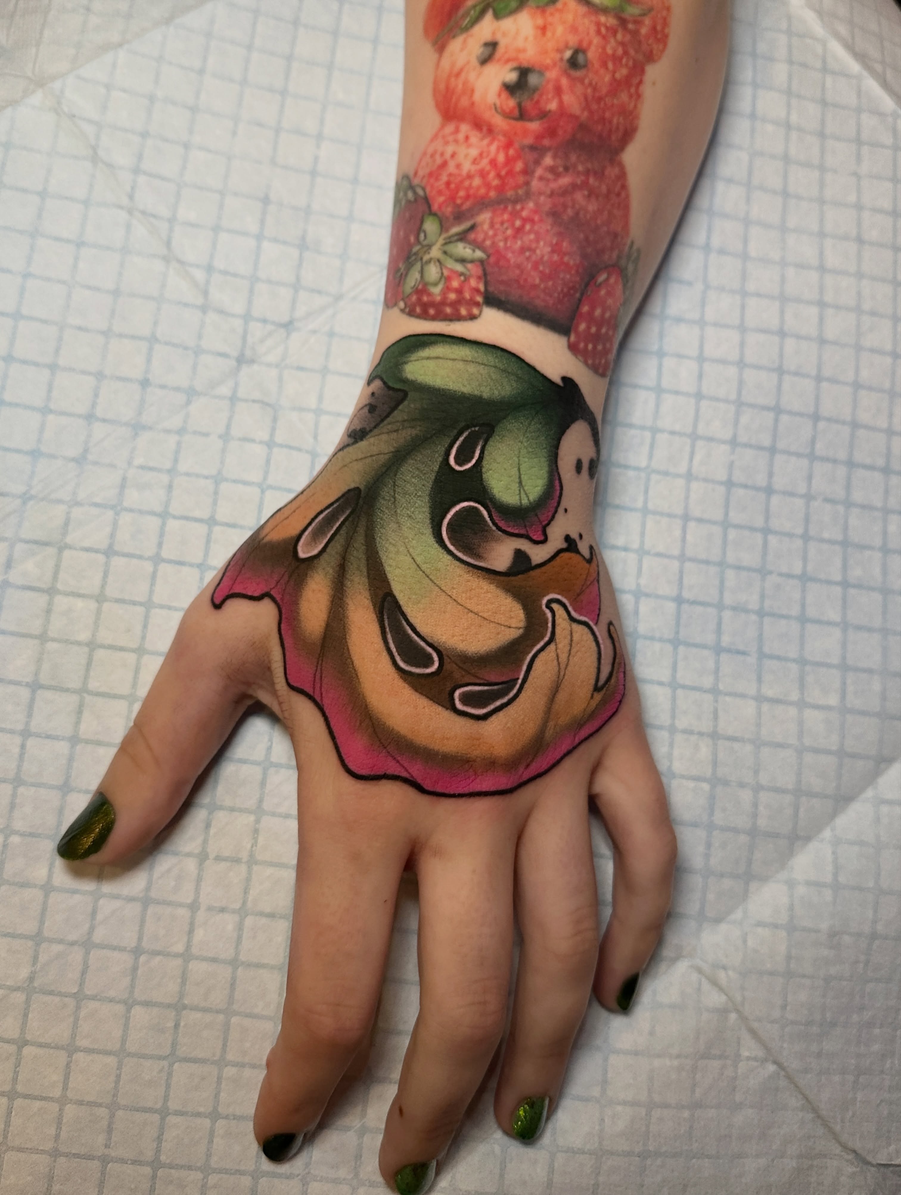 Abstract floral realism tattoo on the hand by Skylar Mangrum
