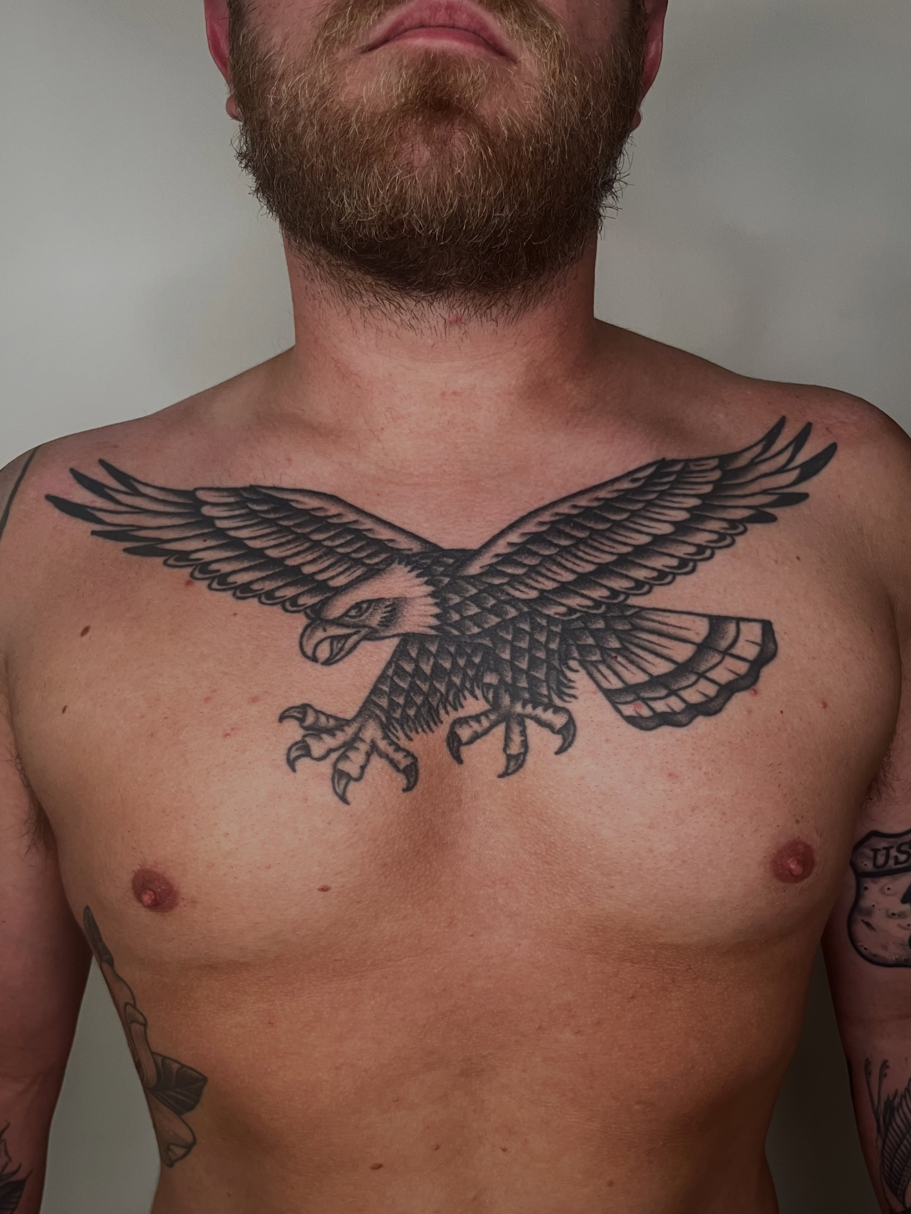 Eagle black and grey tattoo on the chest by Patrick Elijah