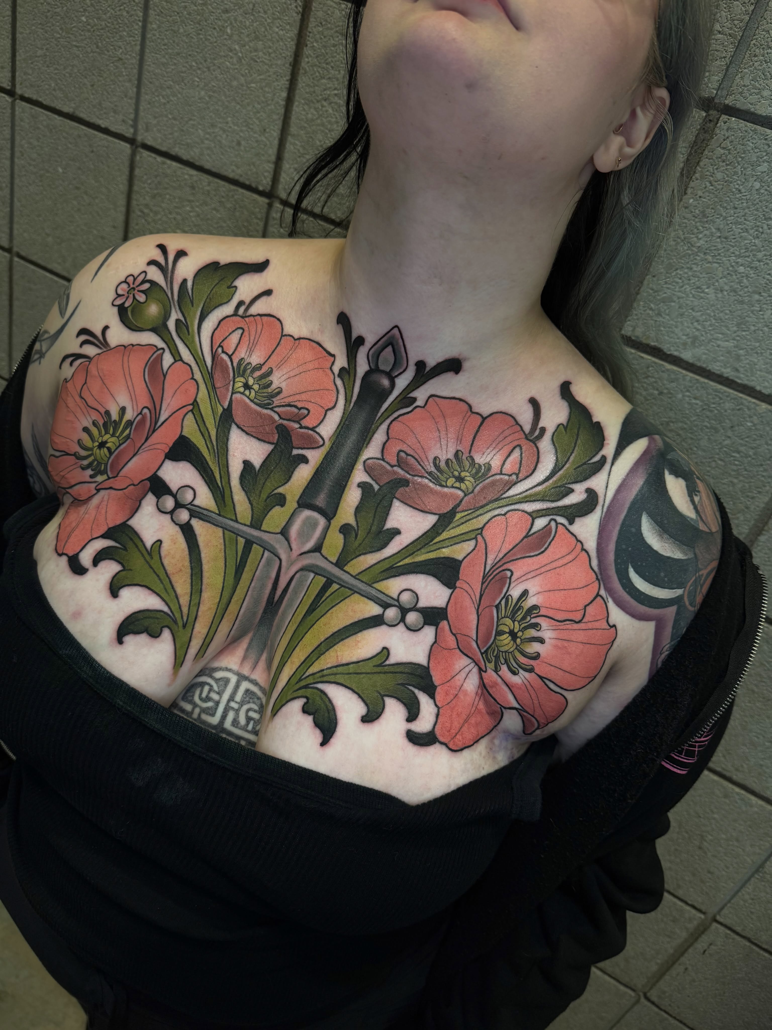 Poppy flowers and dagger American traditional tattoo on the shoulder by Freddie Brown, Lombard, IL