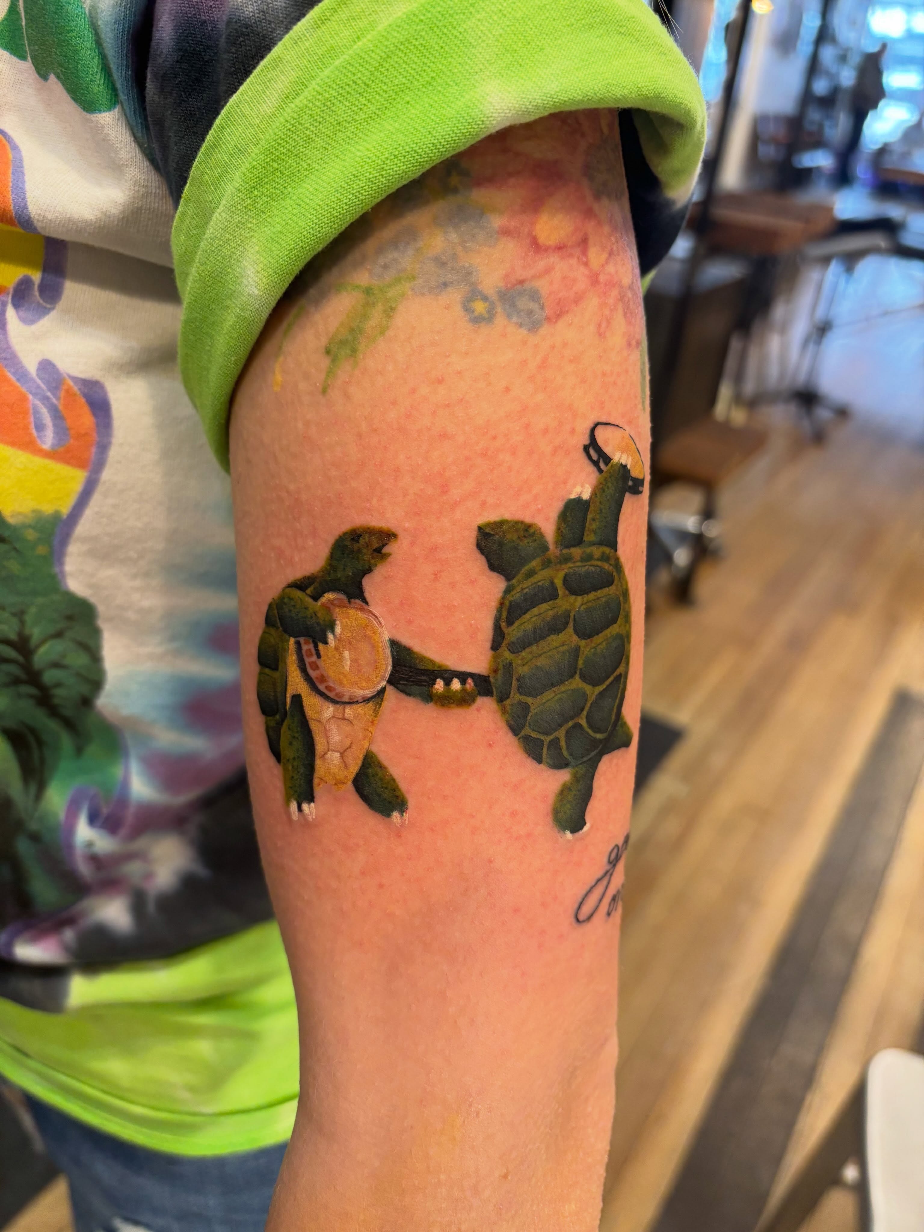 Sea turtles realism tattoo on the forearm by Aubri Aunna