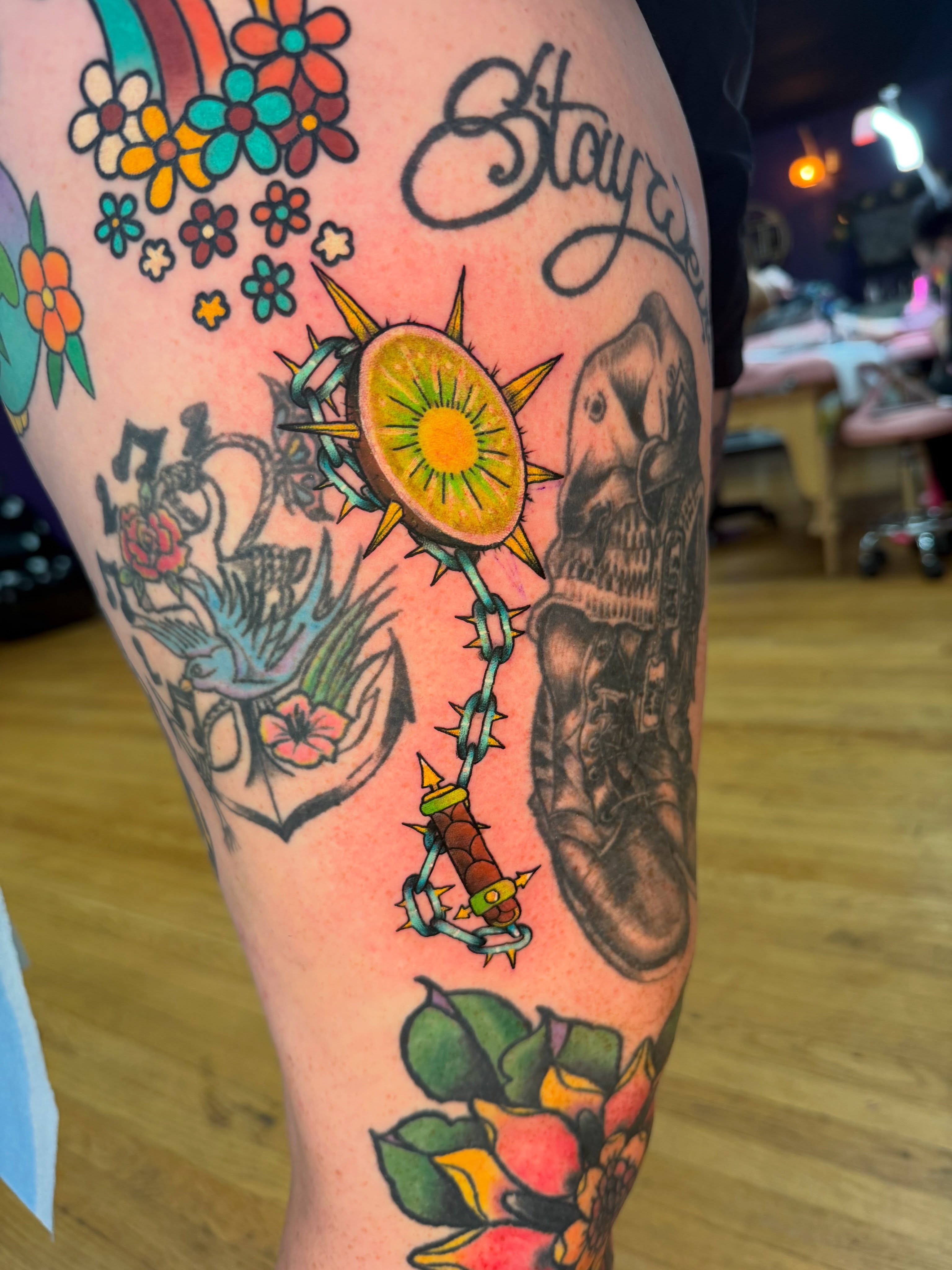Sun and thorns American traditional tattoo on the thigh by Brandon Durbin