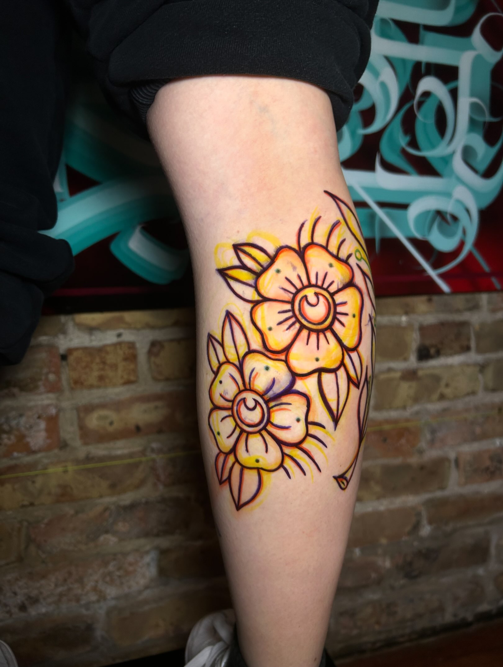 Flowers American traditional tattoo on the forearm by Alycia