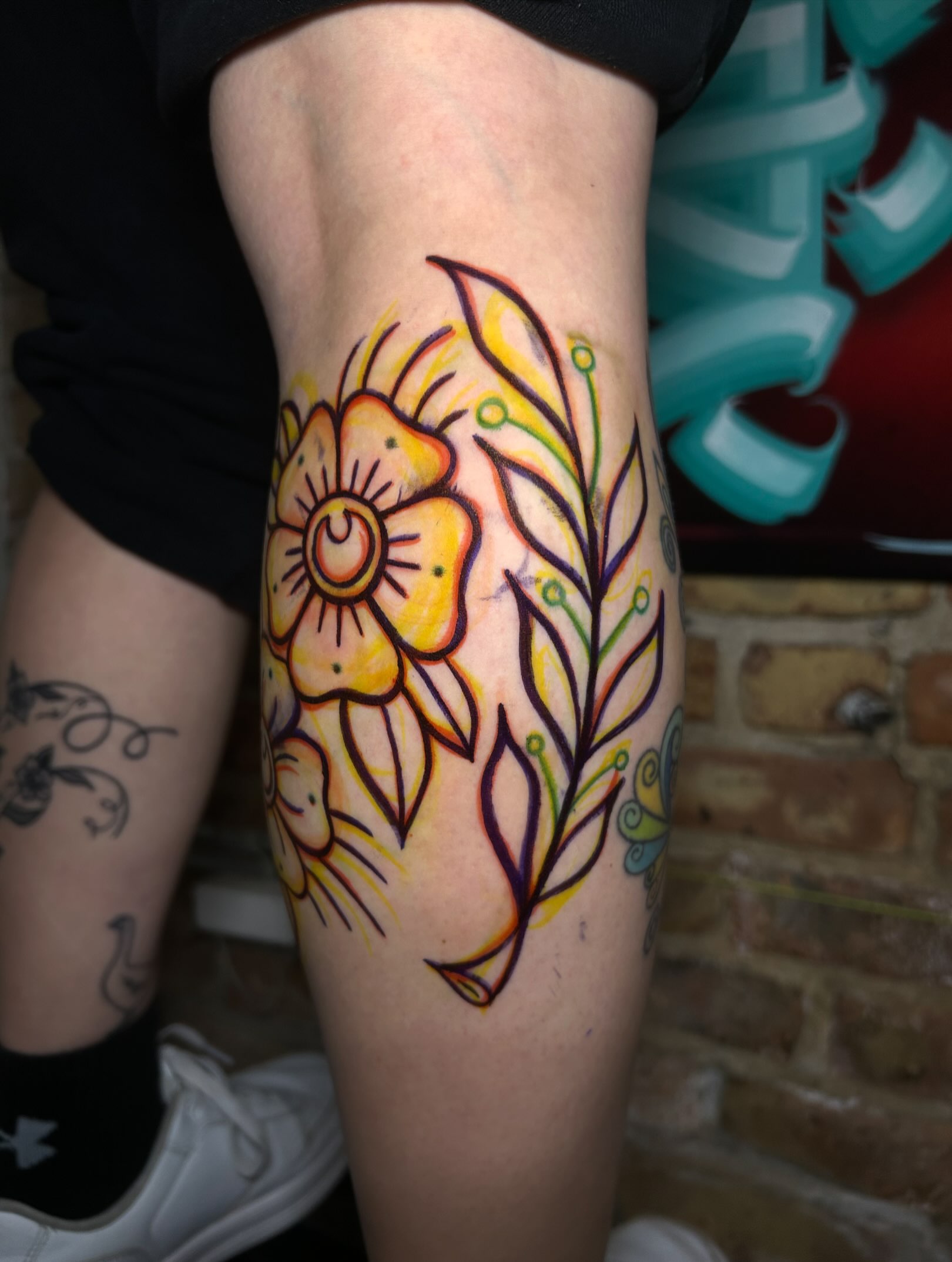Floral design new school tattoo on the thigh by Alycia