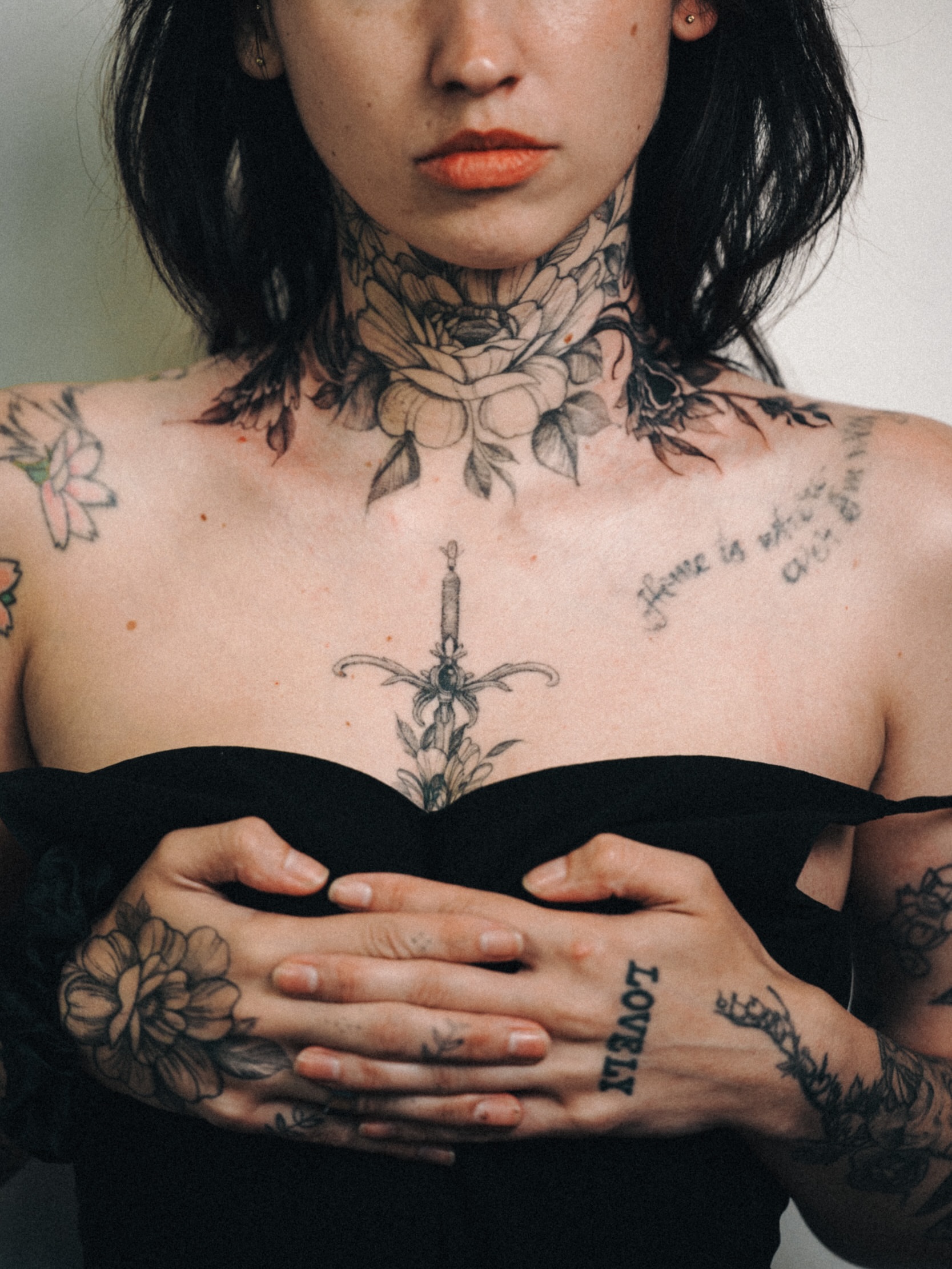 Sword and candle neo-traditional tattoo on the chest by Brad Simmons
