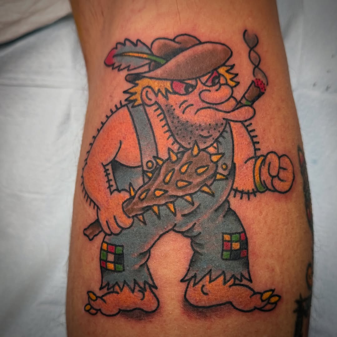 Troll with guitar American traditional tattoo on the forearm by Chris Blanchard