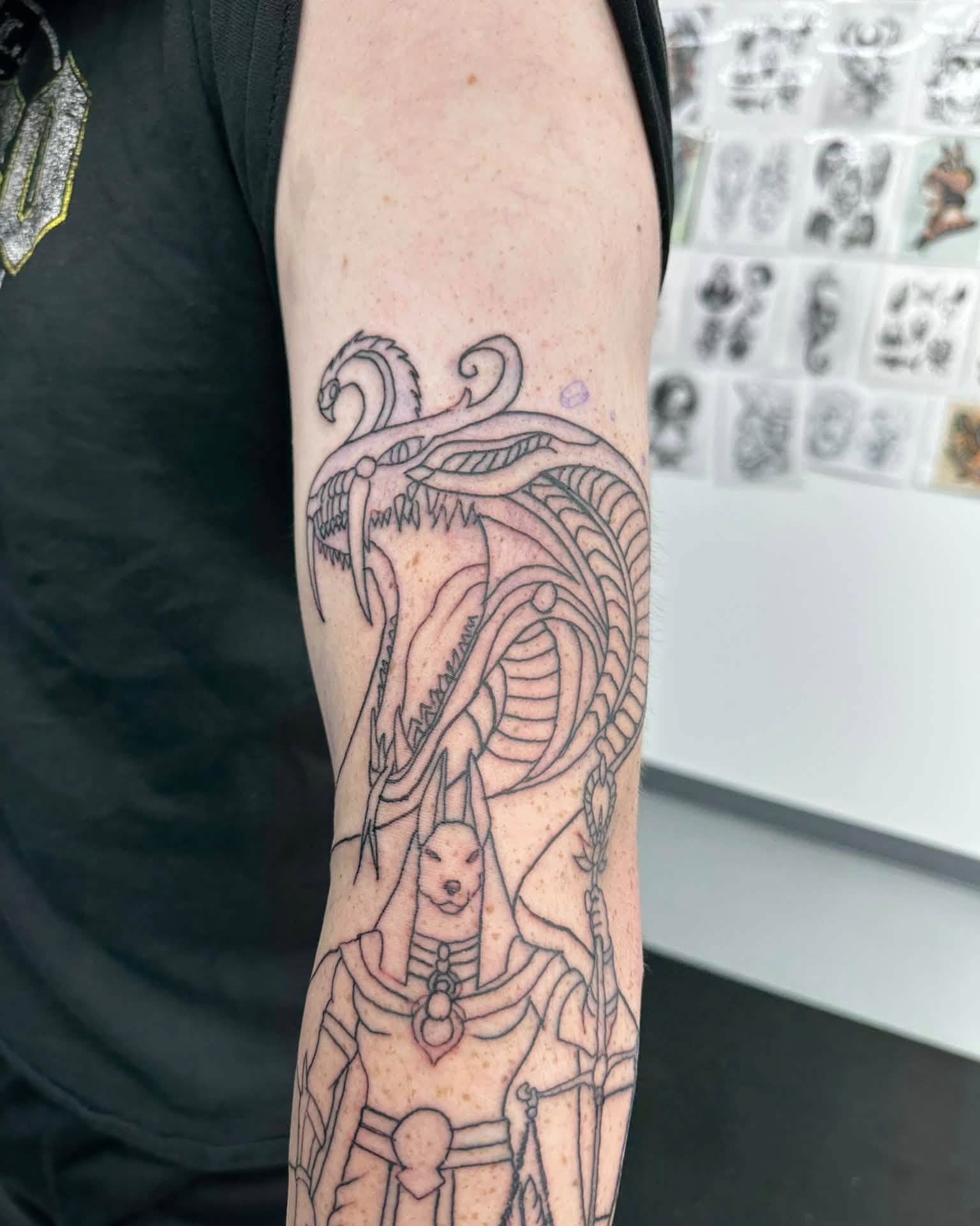 Mythical creature geometric tattoo on the forearm by Brian Lambert