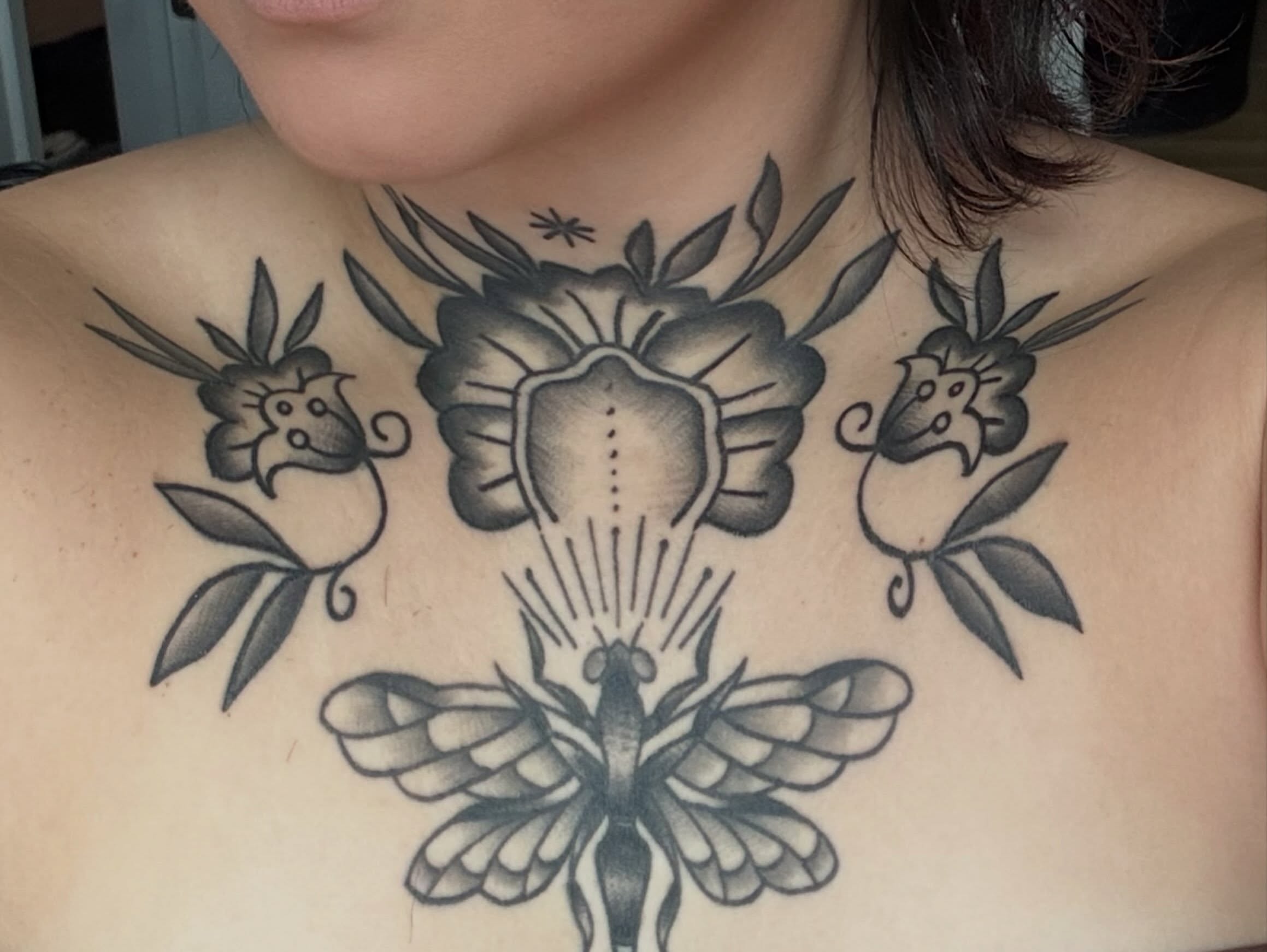 Flower and moth geometric tattoo on the chest by CAT