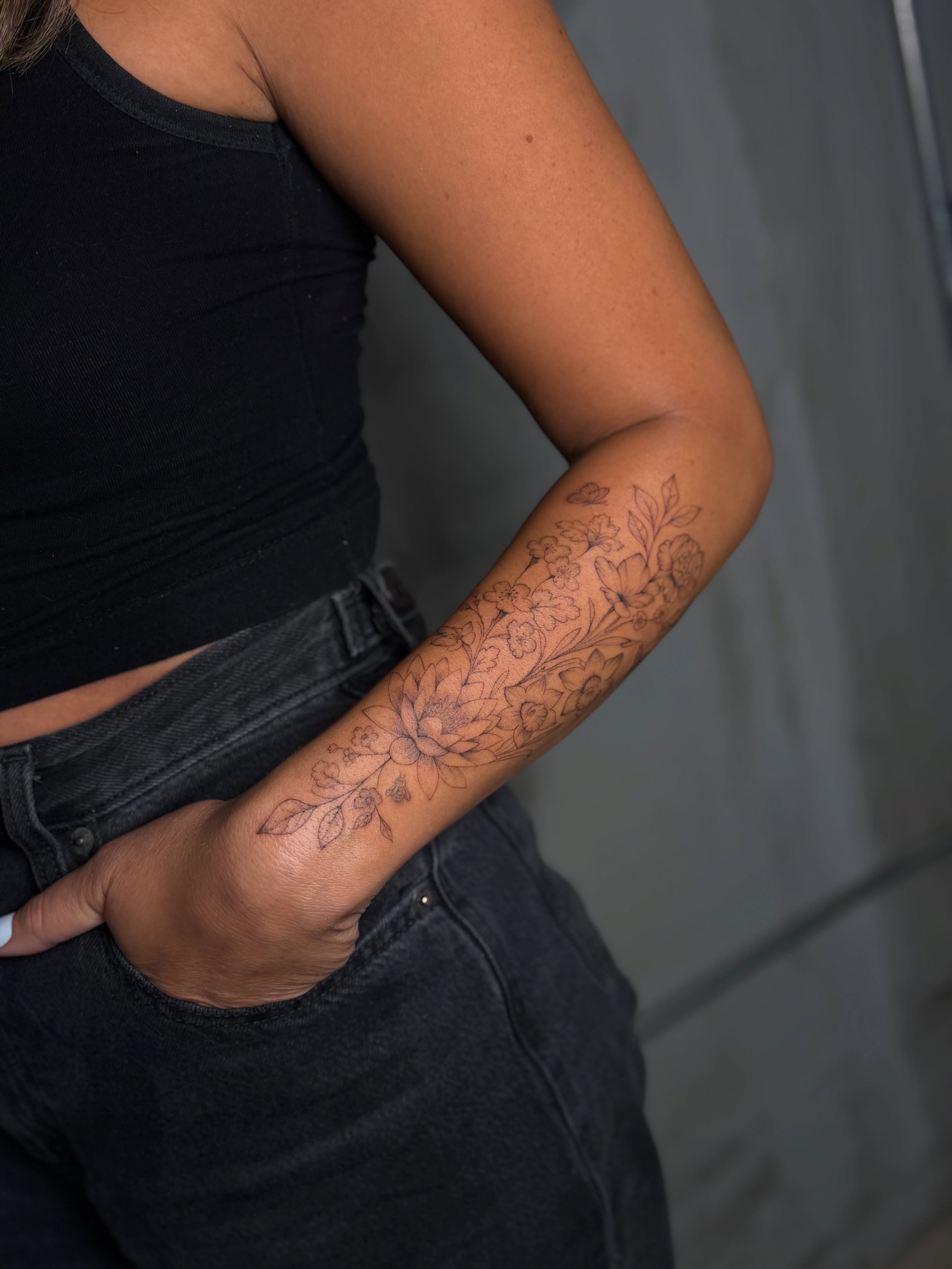 Floral pattern black and grey tattoo on the forearm by 𝙸𝚗𝚔𝚊𝚗𝚍𝚕𝚒𝚕𝚢𝚜 🤎💉🐻🌸