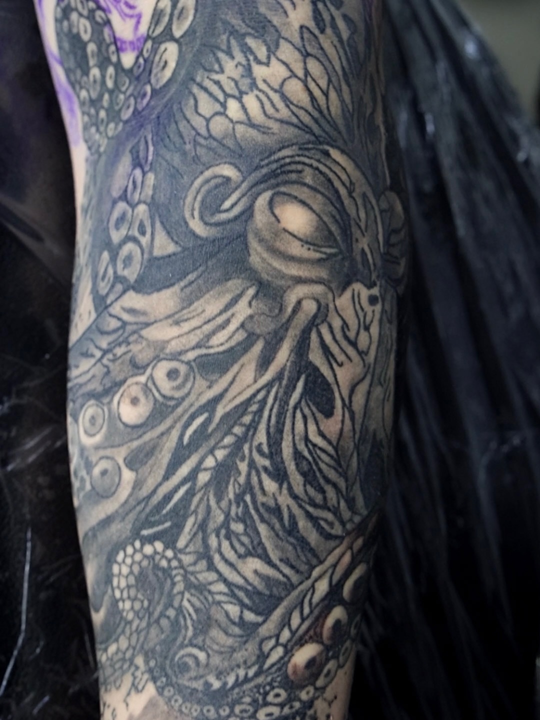 Octopus black and grey tattoo on the forearm by Brandiane Wells