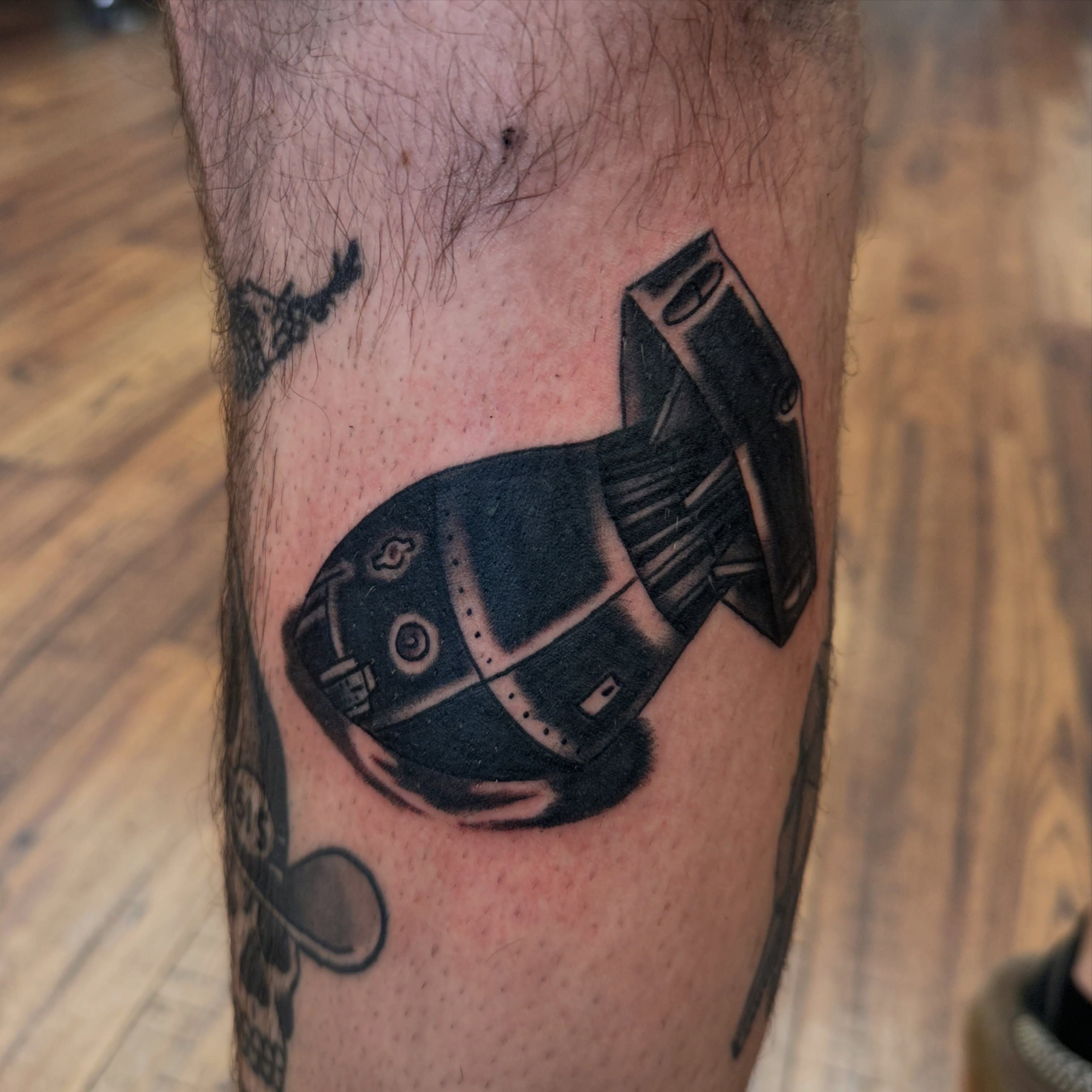 Robot black and grey tattoo on the forearm by Kyle Simmons