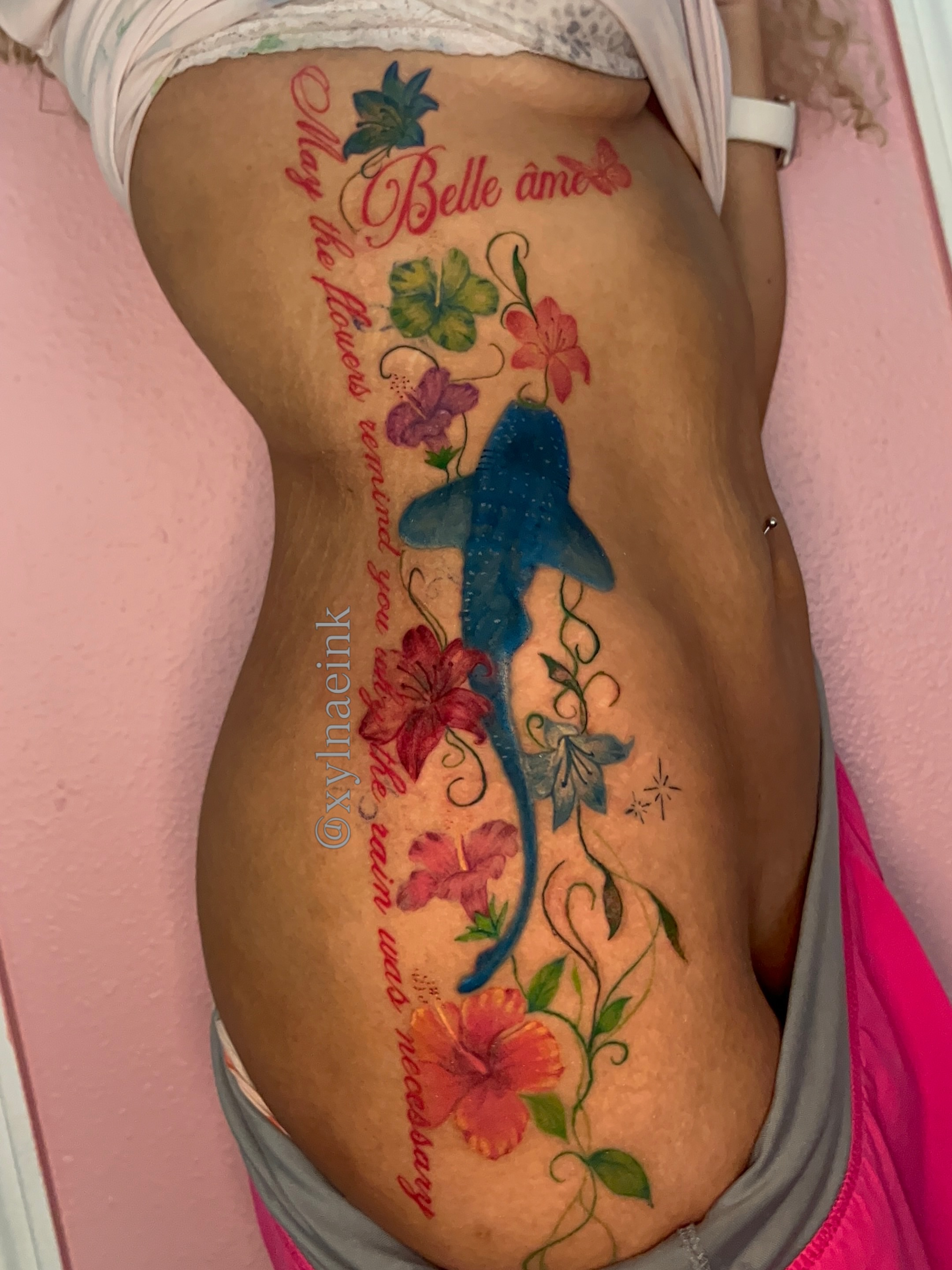 Shark and flowers watercolor tattoo on the ribs by The inspo
