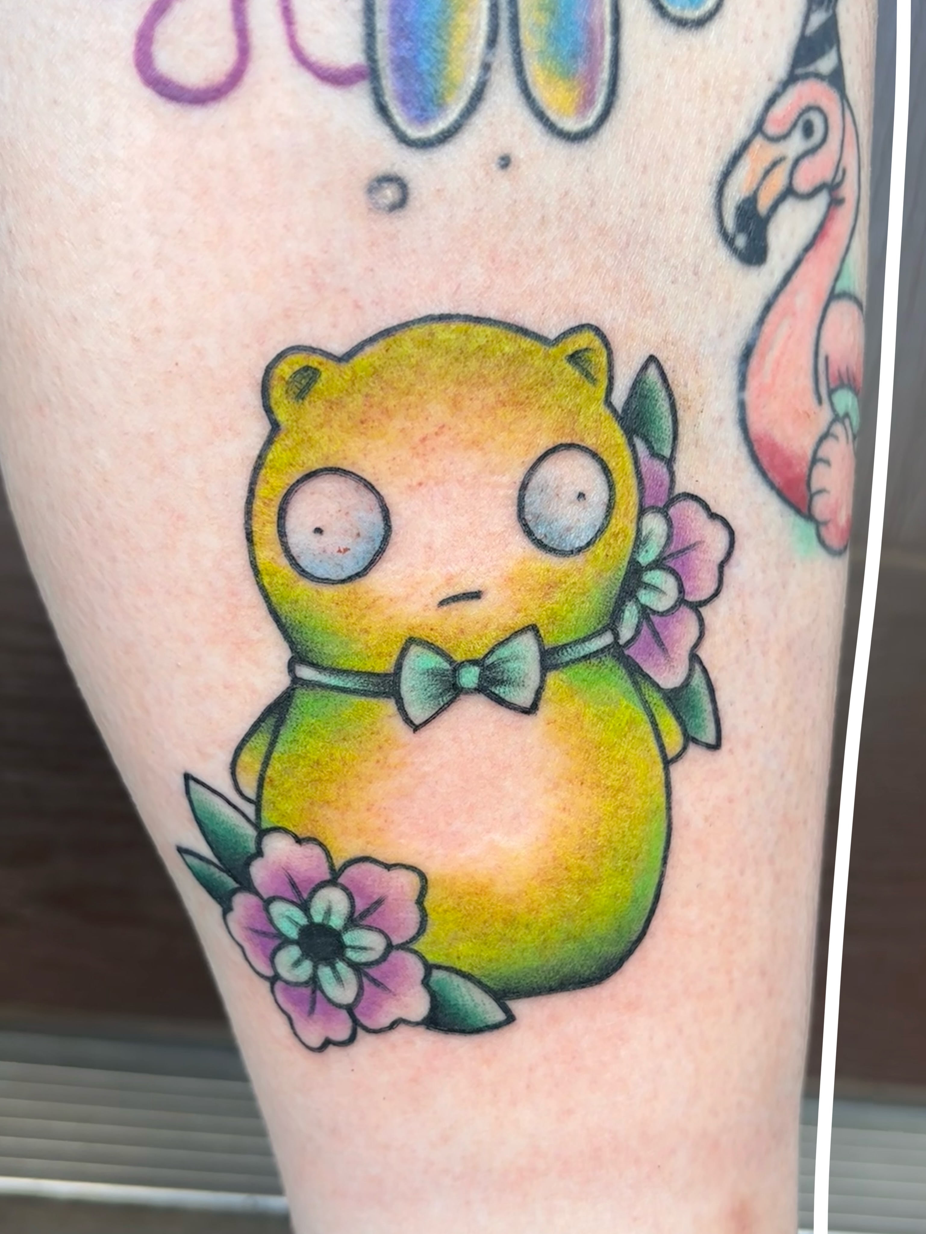 Chibi cat new school tattoo on the thigh by Emmy Stepien
