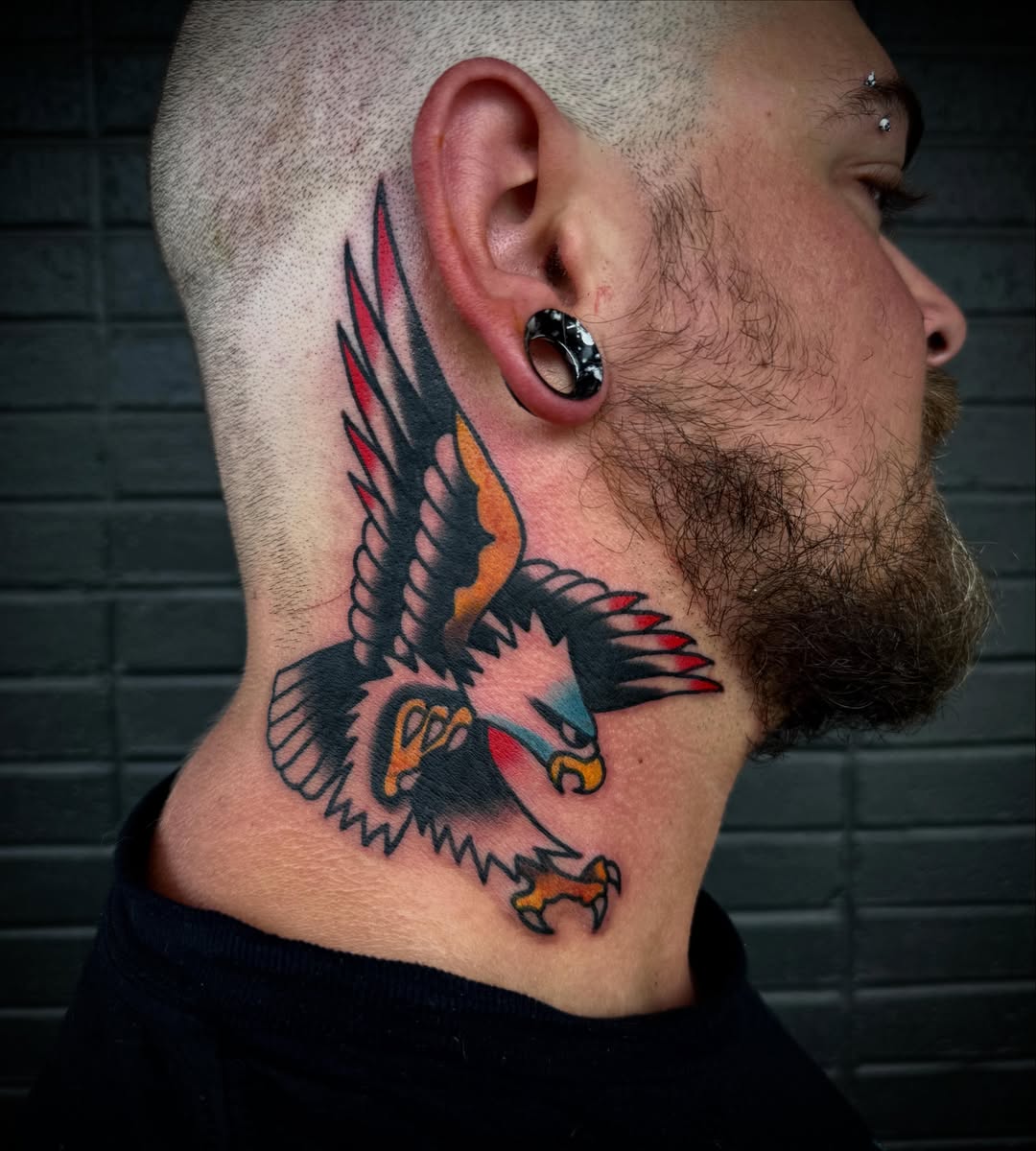 Eagle American traditional tattoo on the neck by Tristan Bradshaw