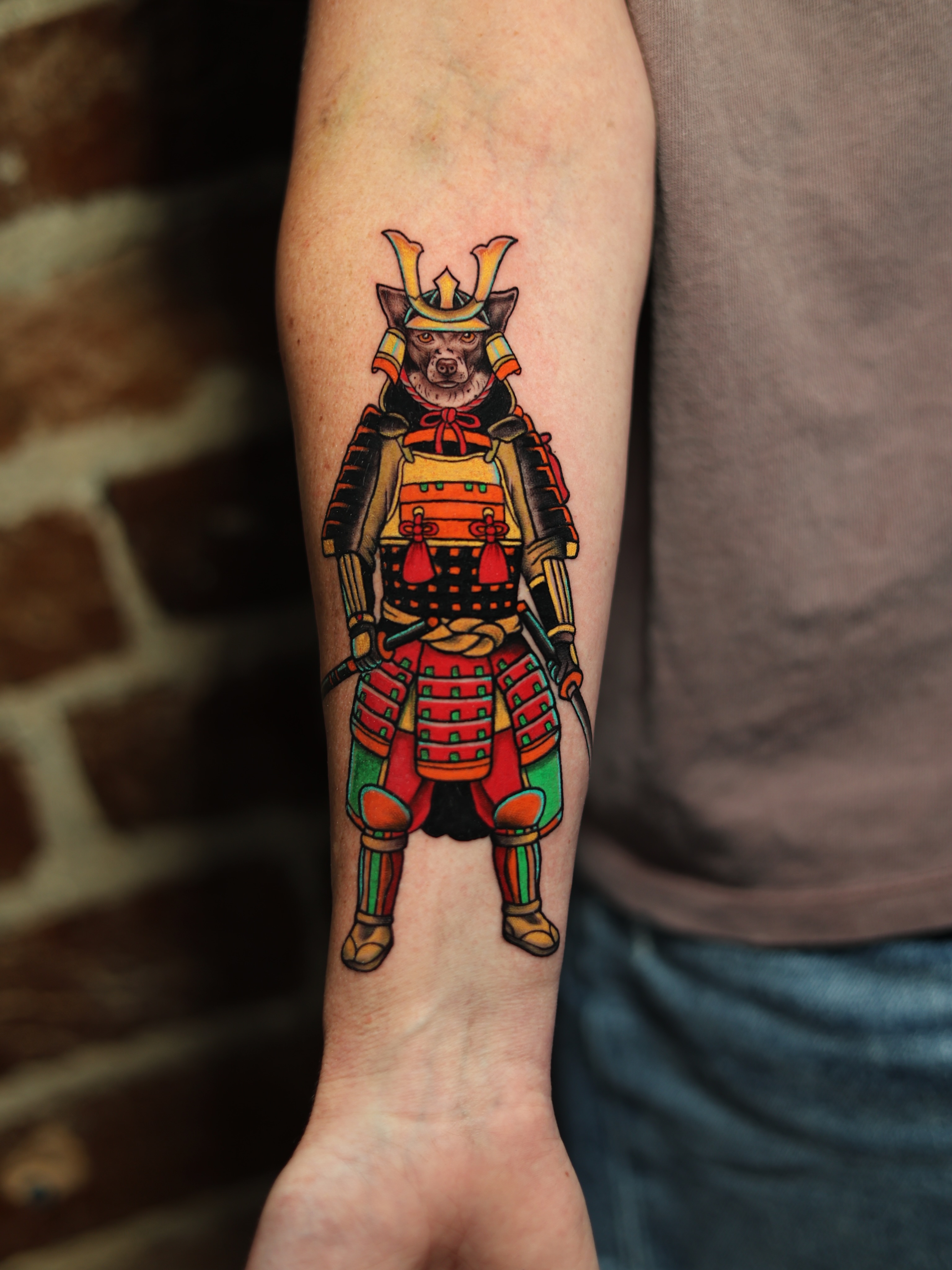 Dog in samurai armor American traditional tattoo on the forearm by Tattoo Artist Los Angeles