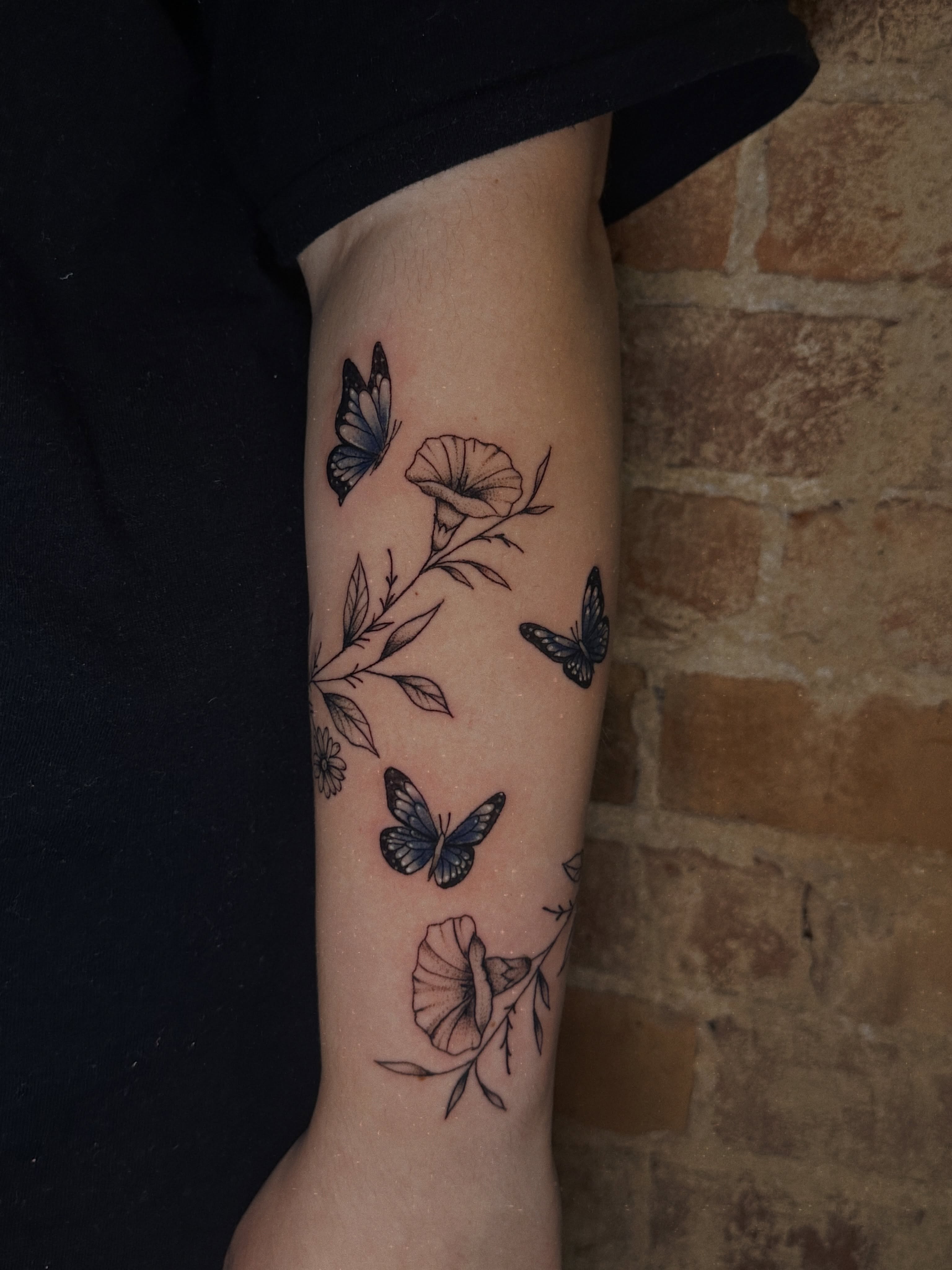 Butterflies and flowers black and grey tattoo on the forearm by E L I Z A H B e T H H D e S I G N S