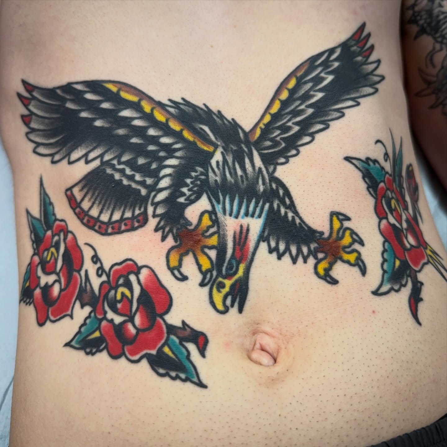 Eagle and roses American traditional tattoo on the ribs by Chuck Paprocki, Nashville, Tennessee