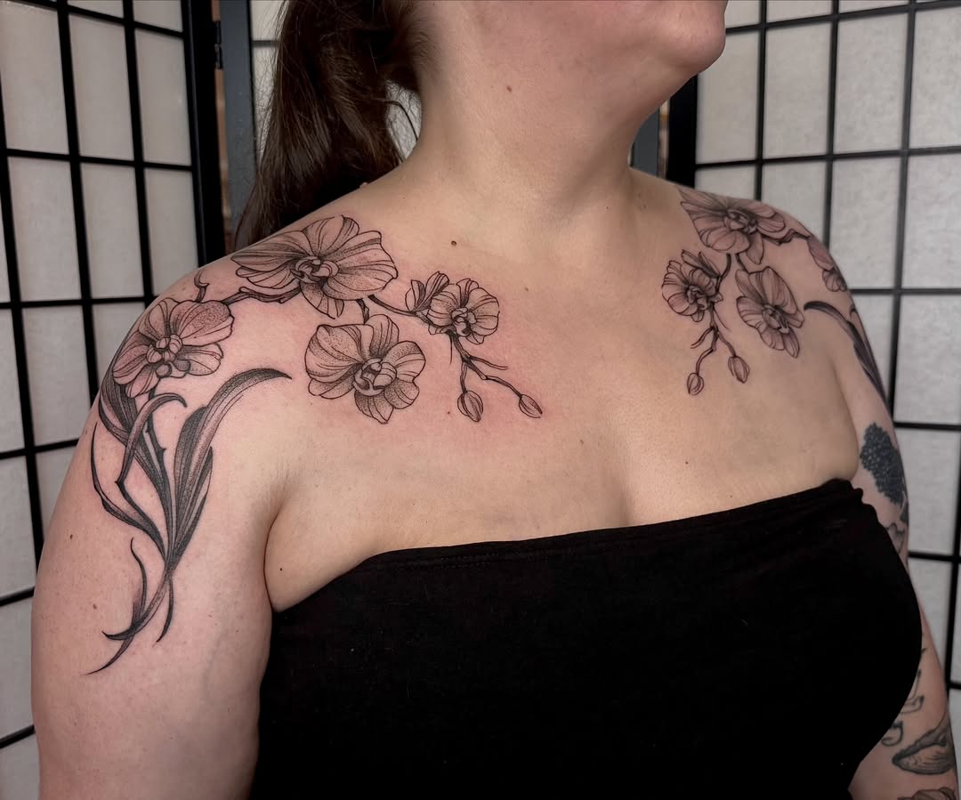 Orchids black and grey tattoo on the shoulder by Lauren Peltz
