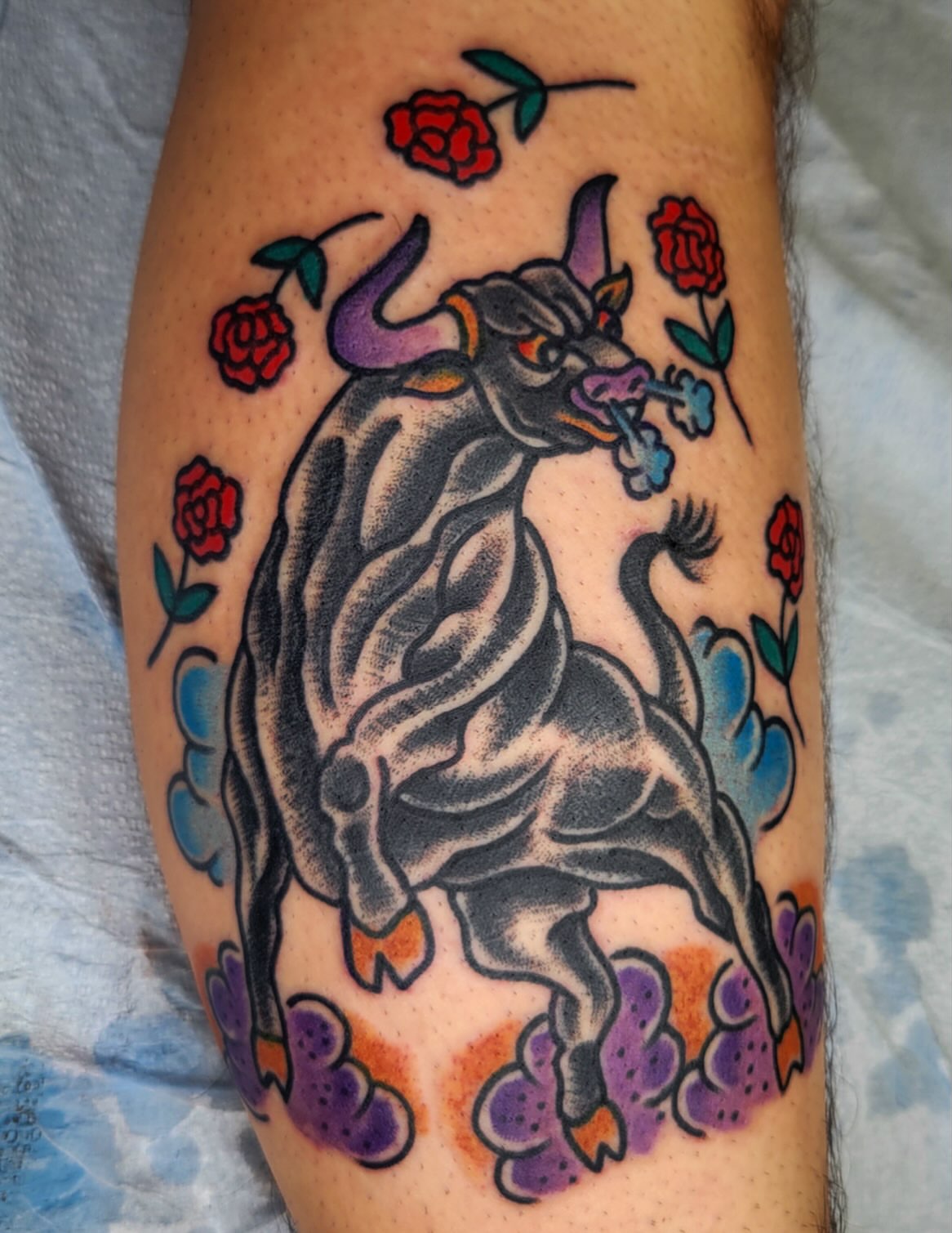 Bull and roses American traditional tattoo on the thigh by joe martinez, Denver, Colorado
