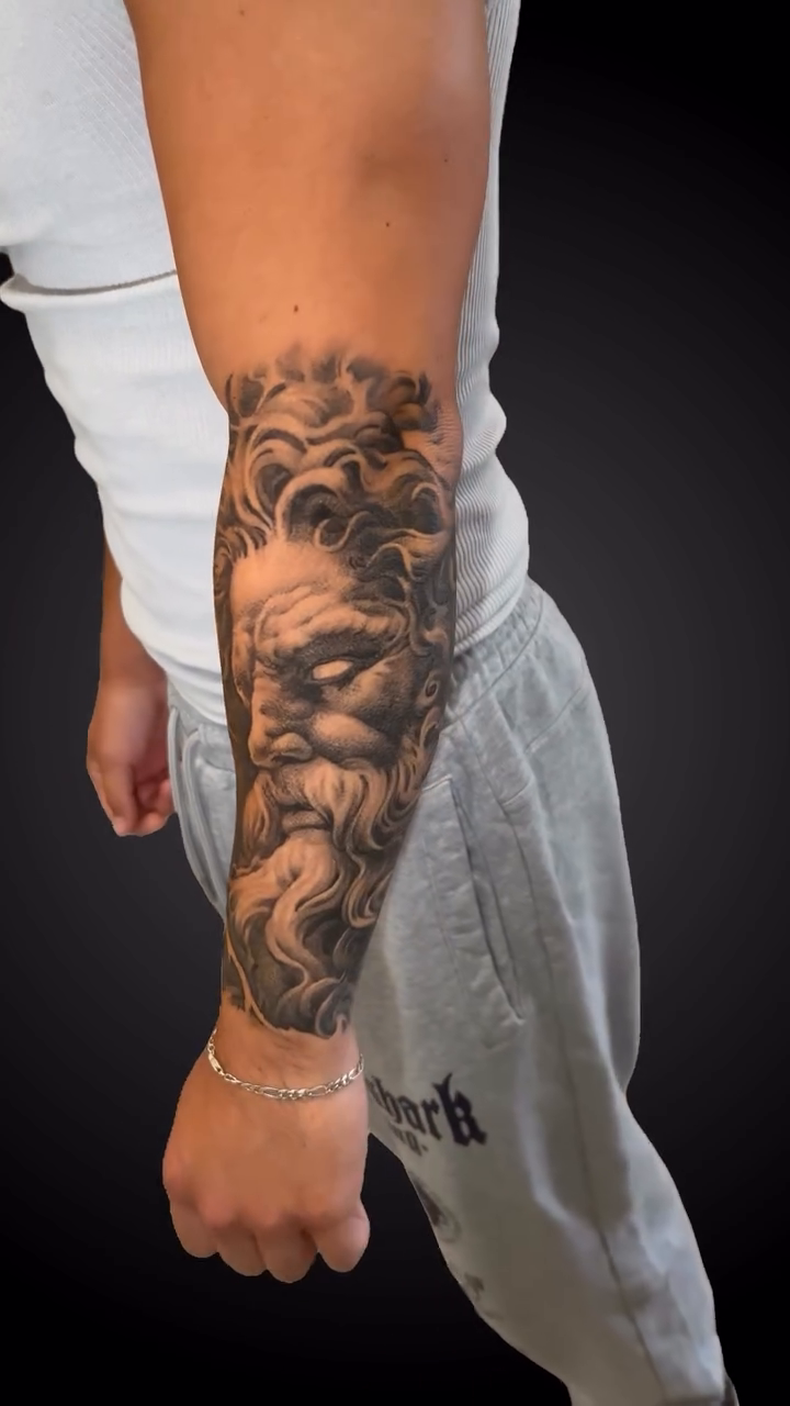 Zeus portrait with storm clouds realism tattoo by Daniel Fisher, Berlin, New Jersey