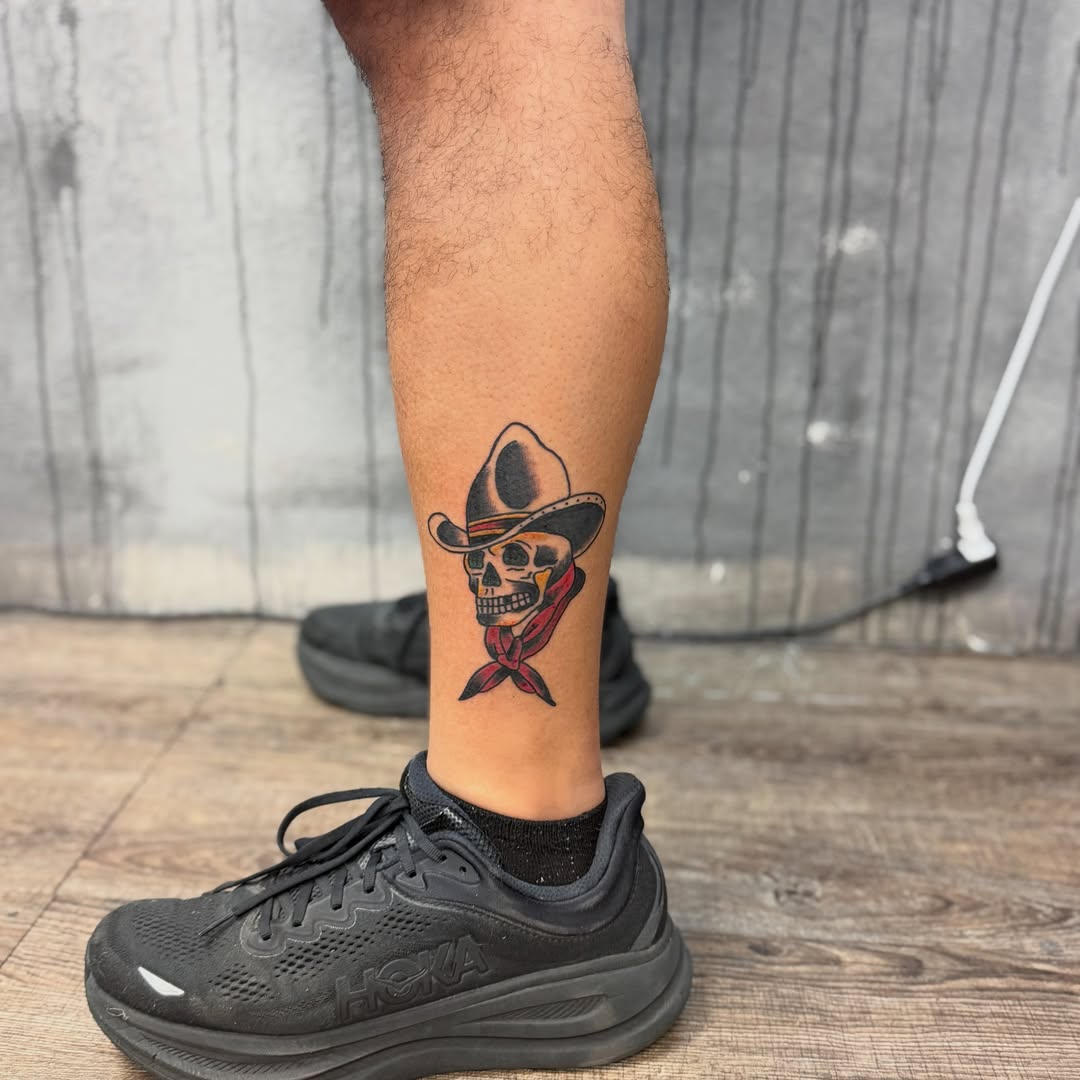 Cowboy skull American traditional tattoo on the calf by Camilo