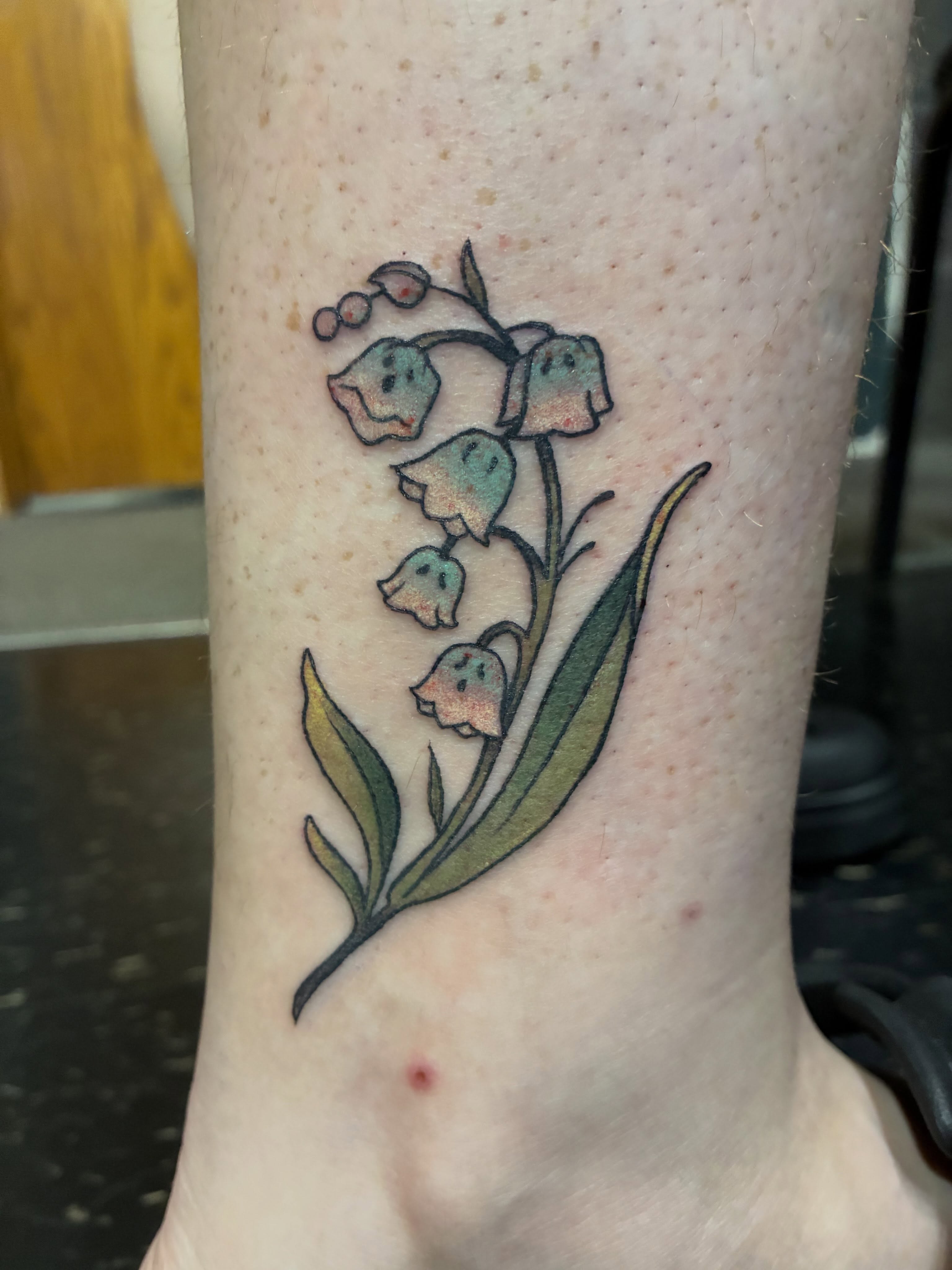 Lily of the valley dotwork tattoo on the forearm by Natalie Spuhler