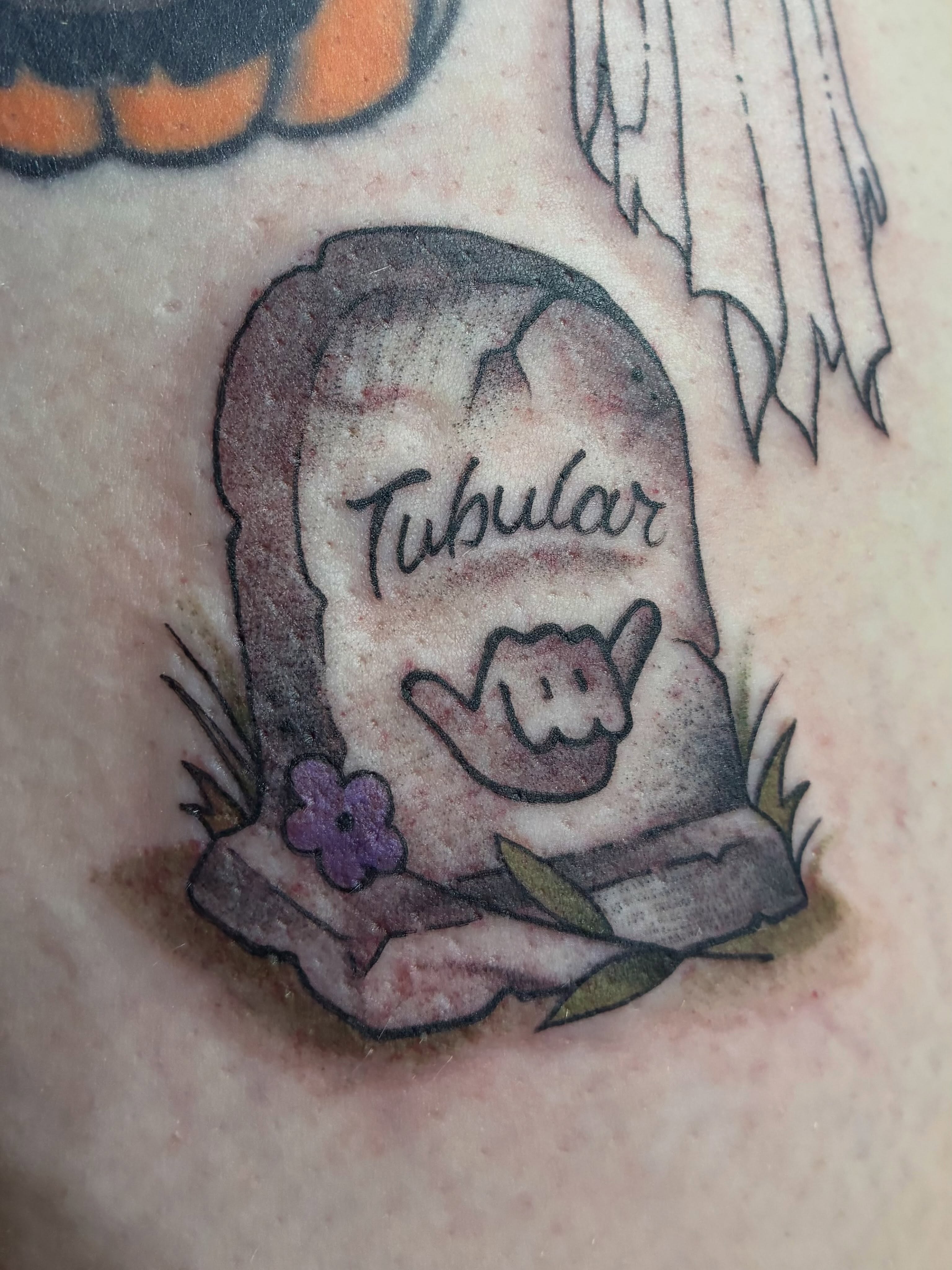 Grave marker with shaka sign watercolor tattoo by Natalie Spuhler